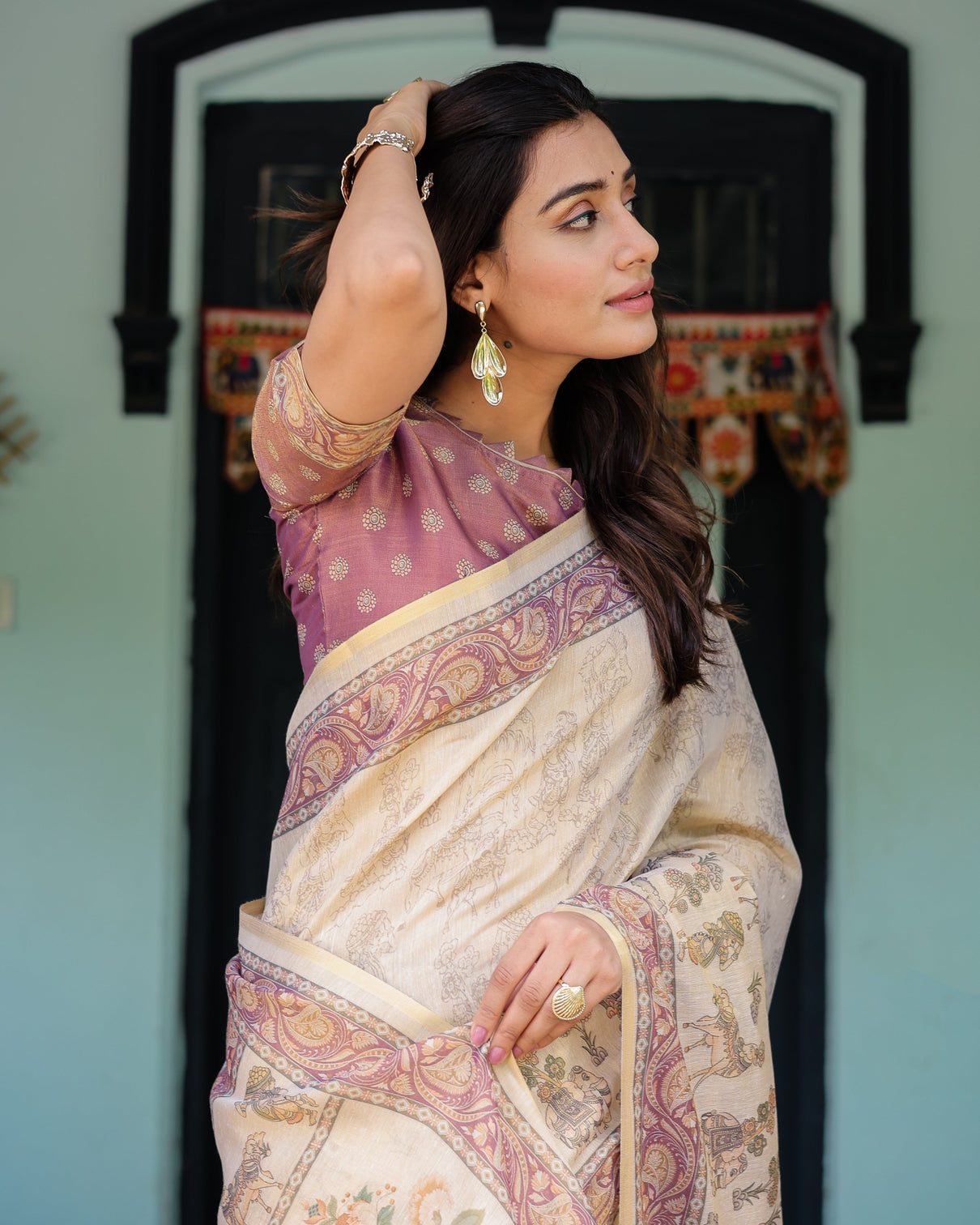 Beige mauve handloom cotton saree with subtle ramayan print and heritage motif pallu