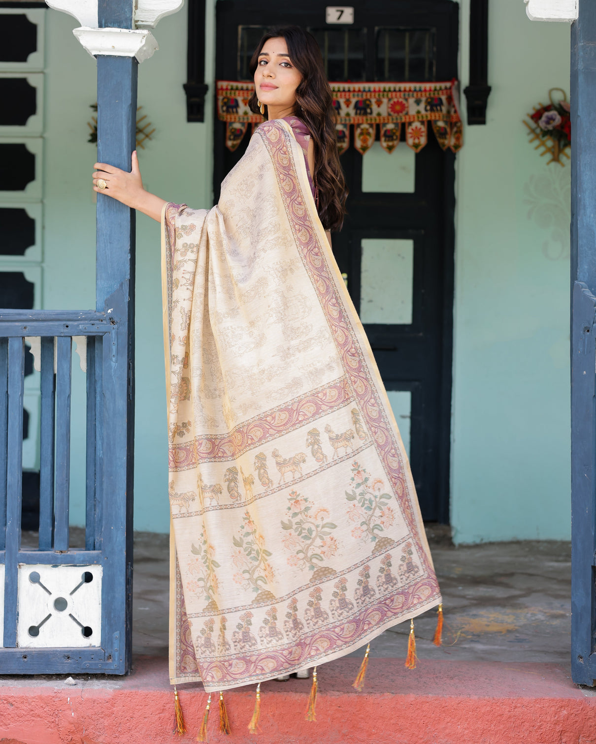 Beige mauve handloom cotton saree with subtle ramayan print and heritage motif pallu