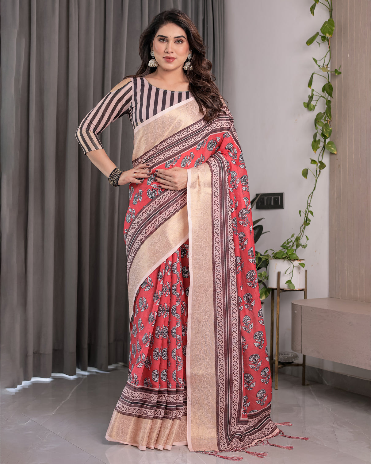 Rust red handloom cotton linen saree with black floral buti print zari border