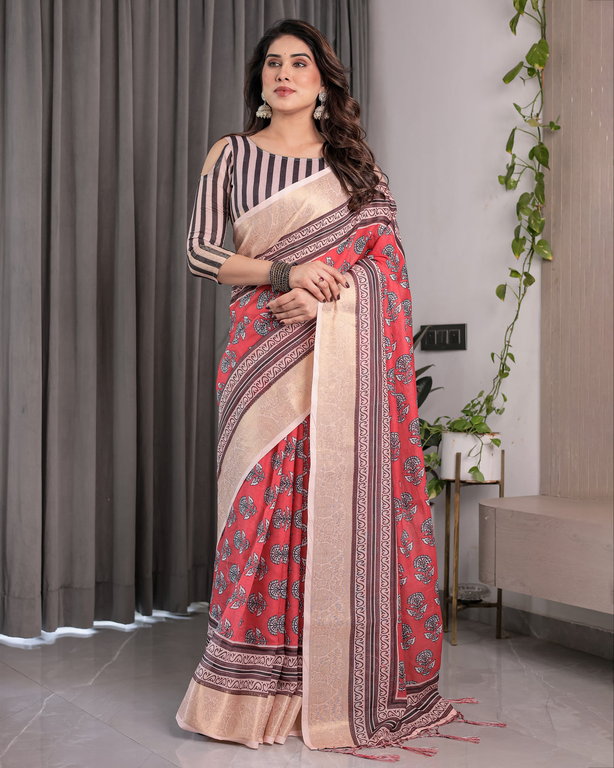 Rust red handloom cotton linen saree with black floral buti print zari border
