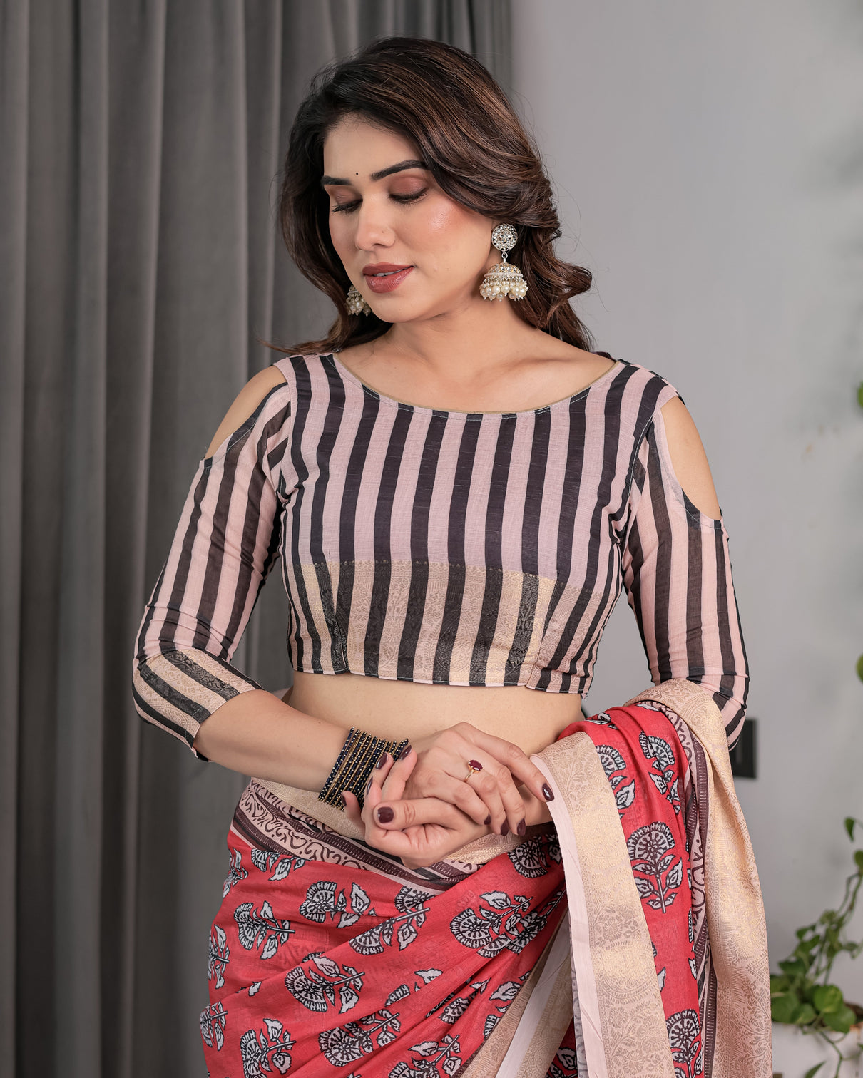 Rust red handloom cotton linen saree with black floral buti print zari border