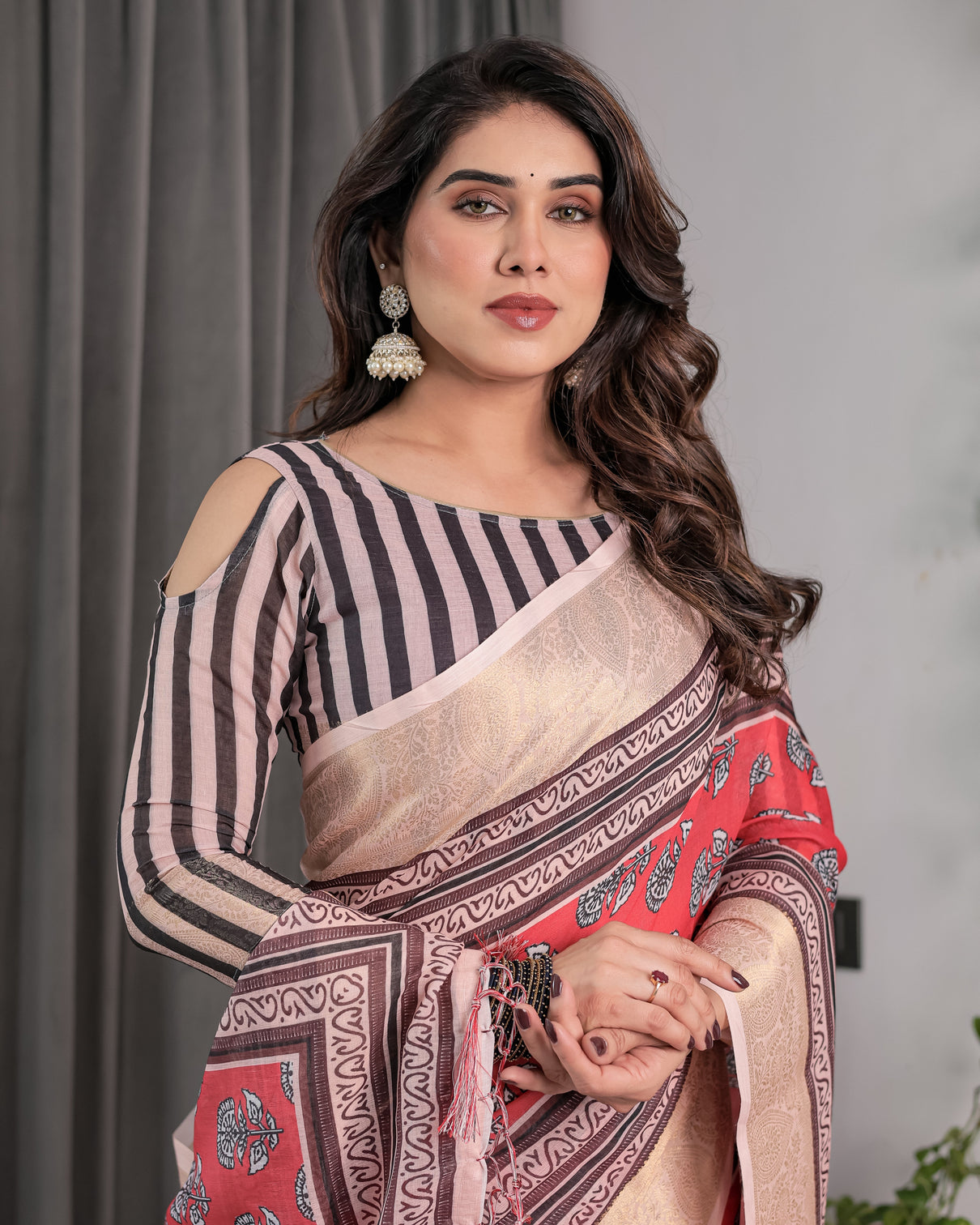Rust red handloom cotton linen saree with black floral buti print zari border