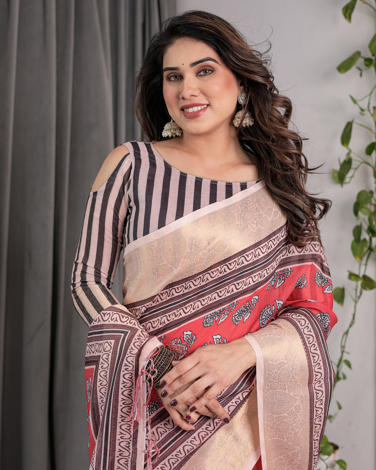 Rust red handloom cotton linen saree with black floral buti print zari border