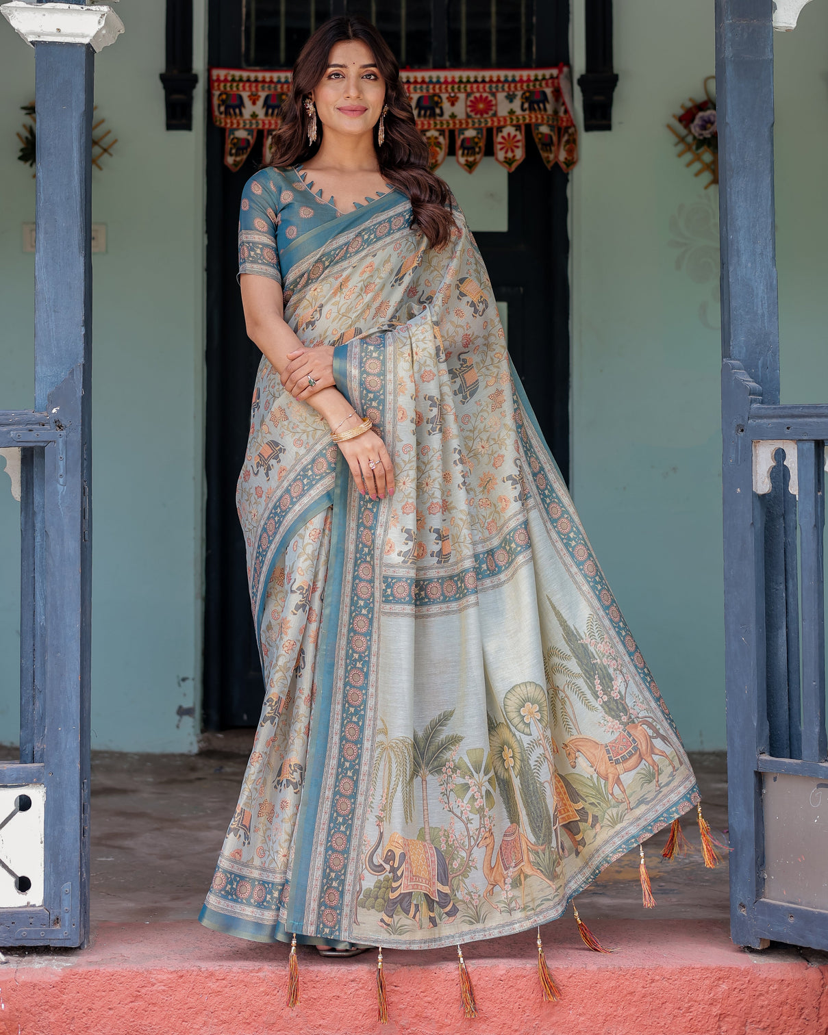 Icy blue handloom cotton saree with peach elephant motifs royal procession pallu mameraa
