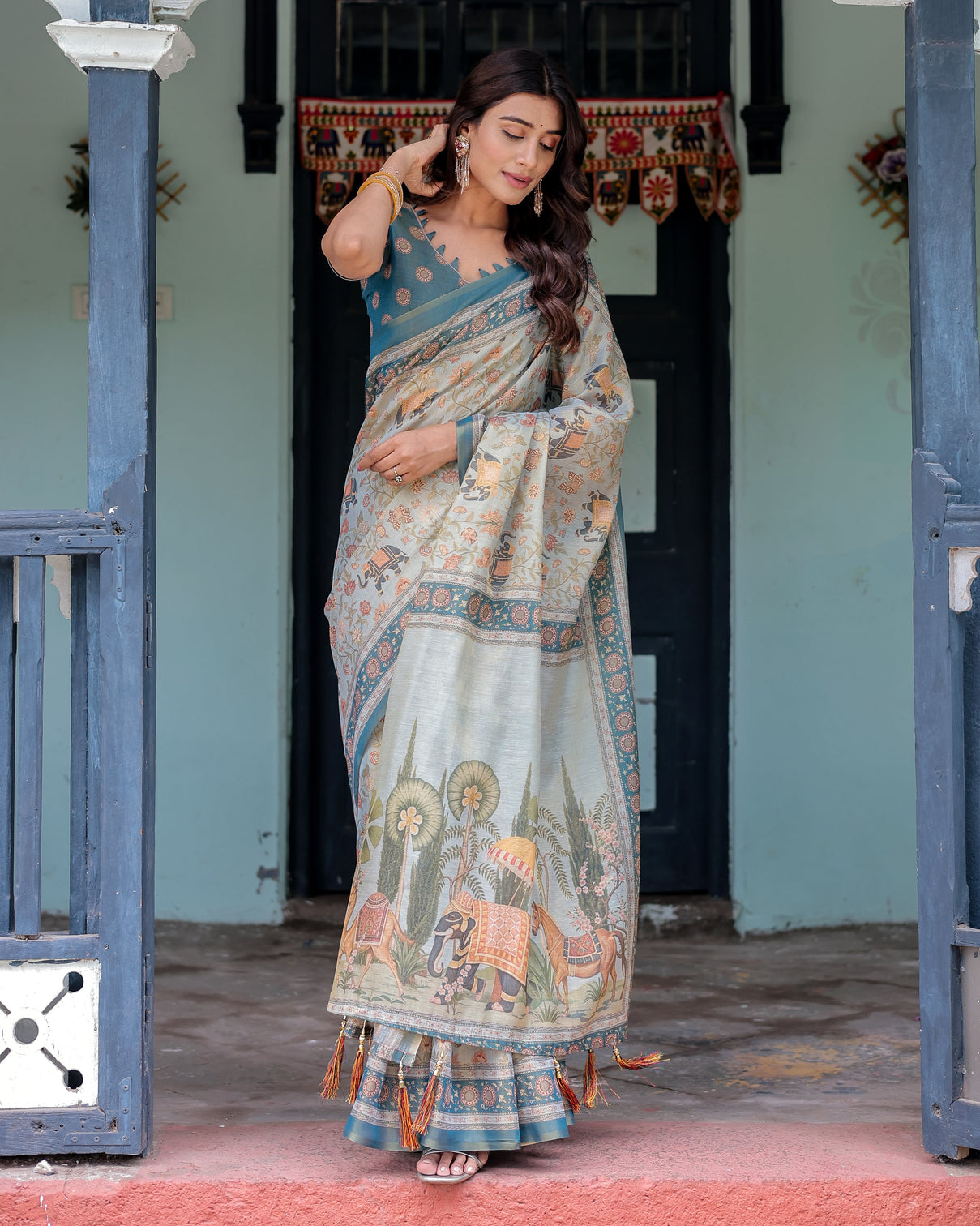 Icy blue handloom cotton saree with peach elephant motifs royal procession pallu