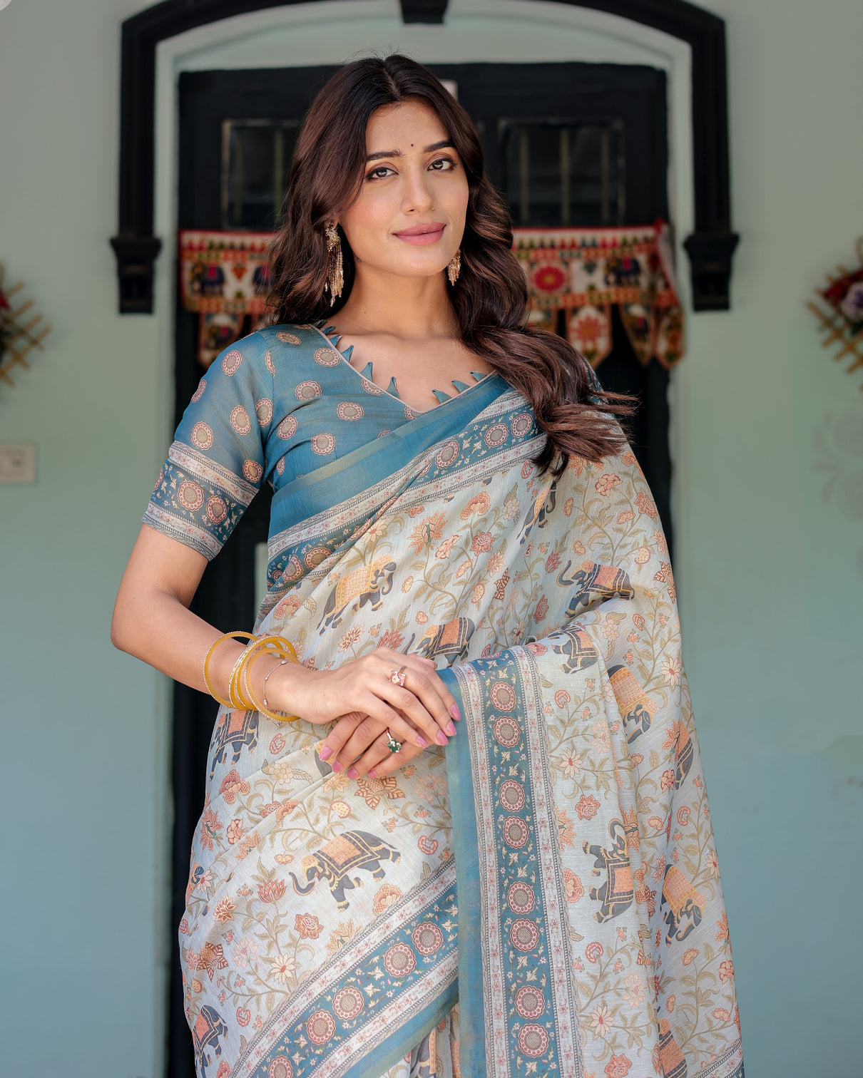 Icy blue handloom cotton saree with peach elephant motifs royal procession pallu