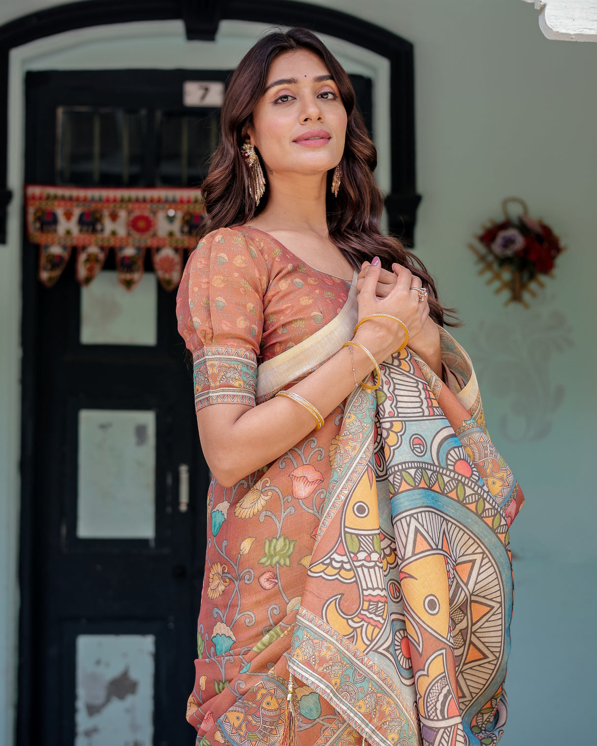 Terracotta handloom cotton saree with blooming floral print madhubani fish pallu