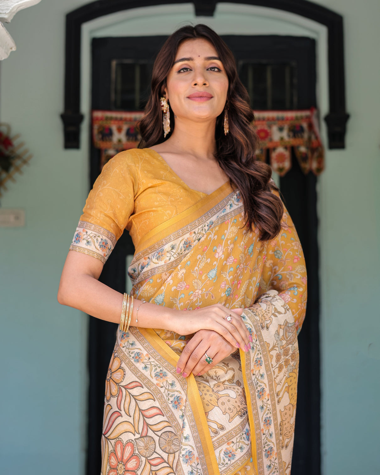 Golden mustard handloom cotton saree with floral vines graceful deer pallu