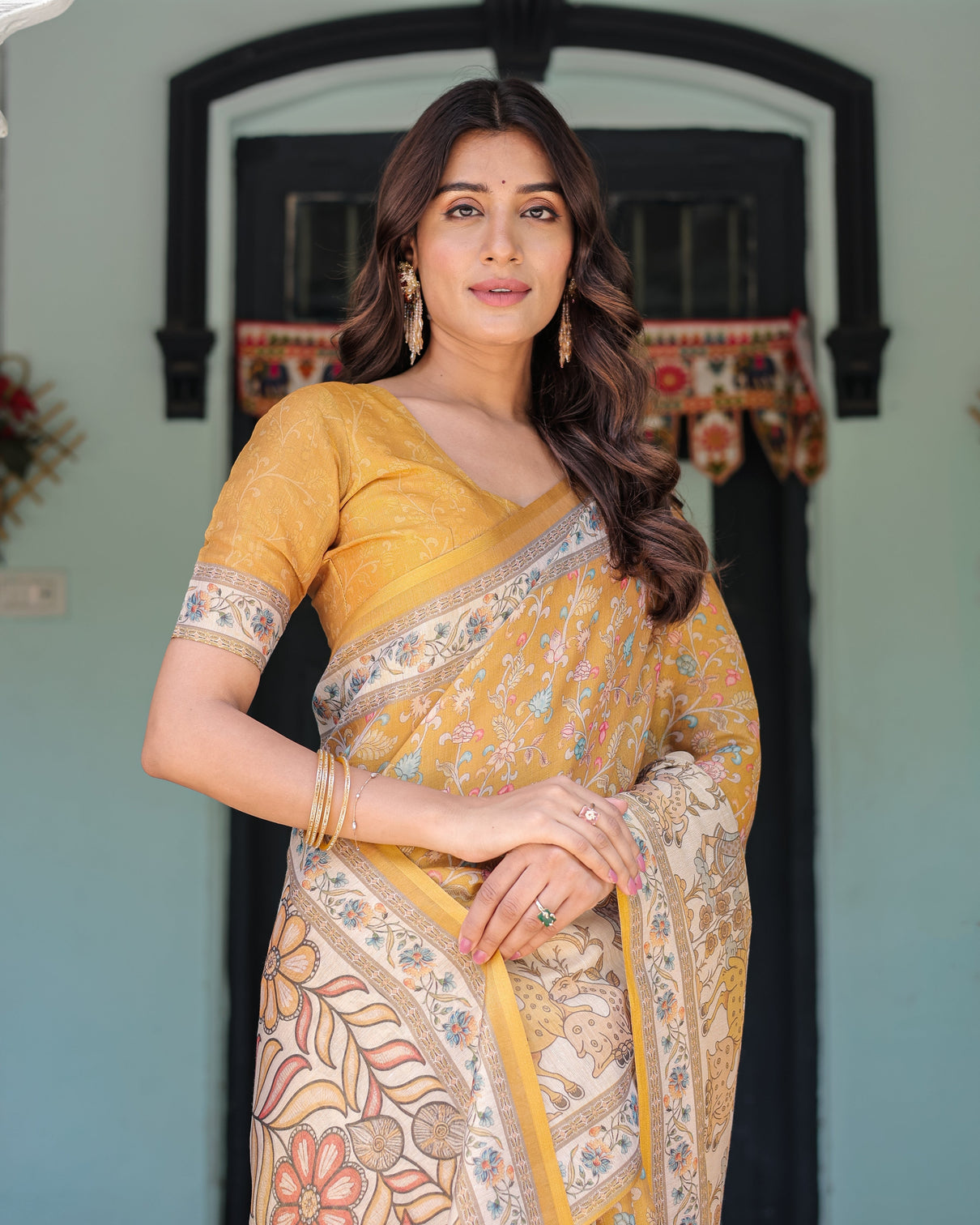 Golden mustard handloom cotton saree with floral vines graceful deer pallu