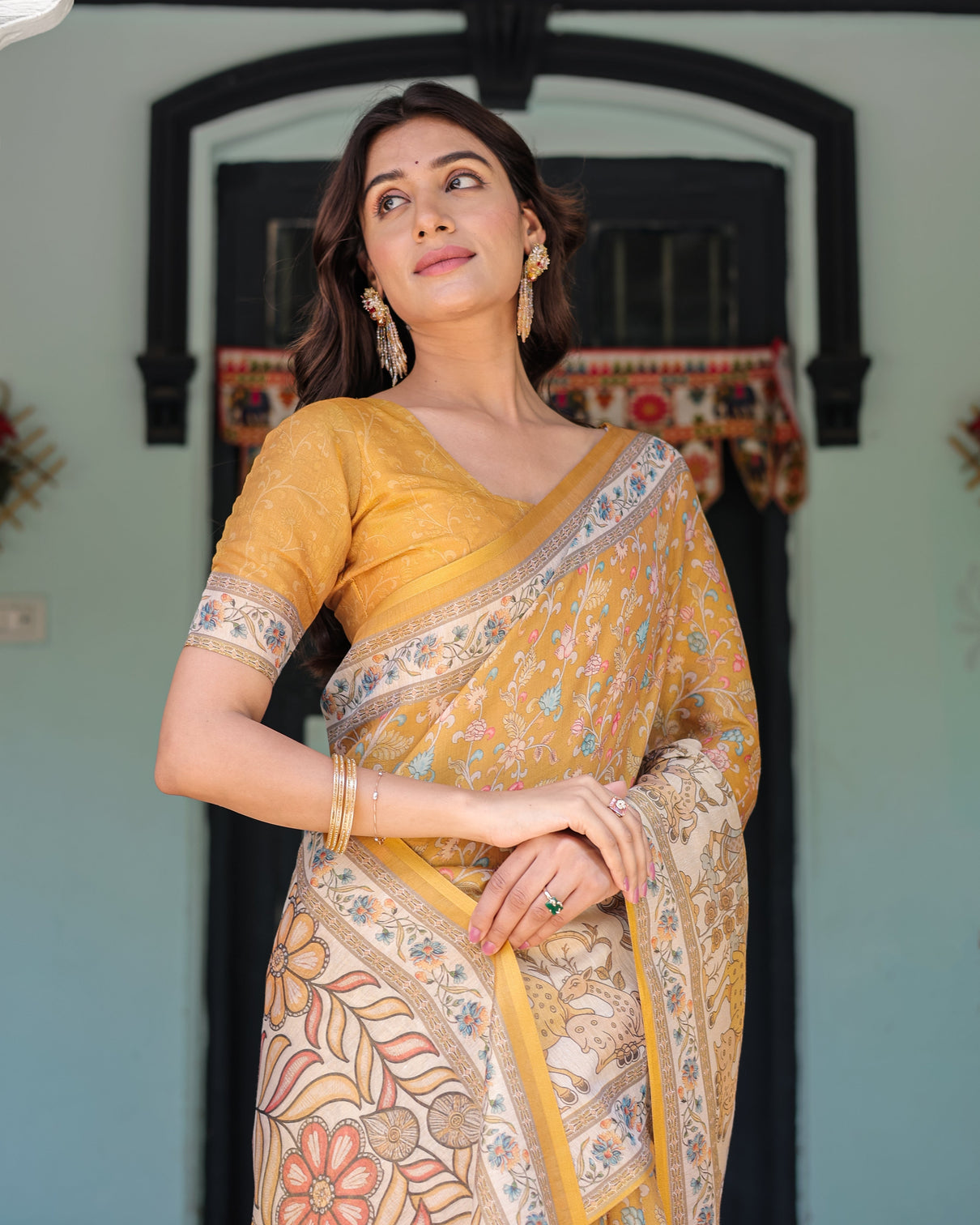 Golden mustard handloom cotton saree with floral vines graceful deer pallu
