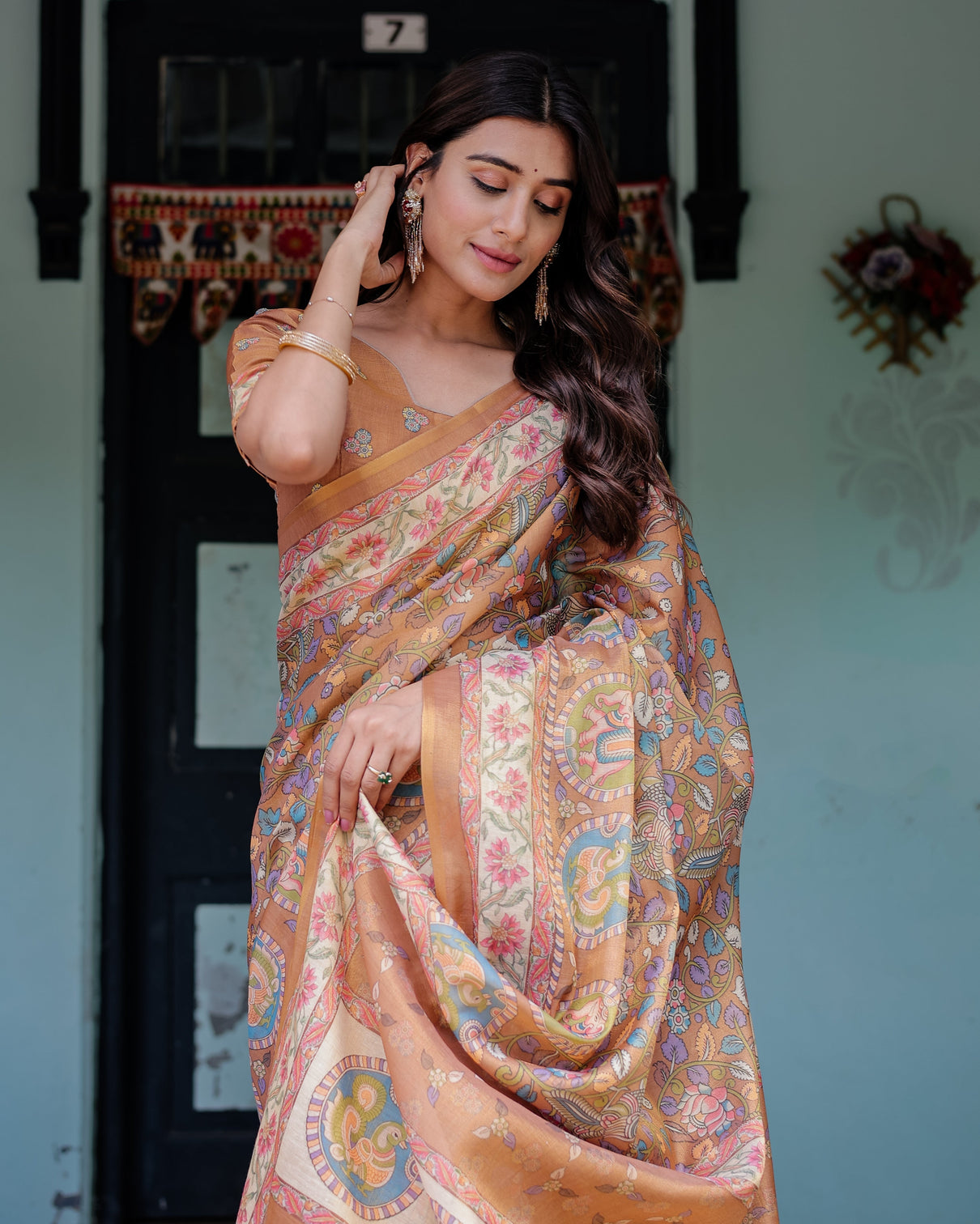 Terracotta peach handloom cotton saree with multicolor floral vines kalamkari inspired pallu