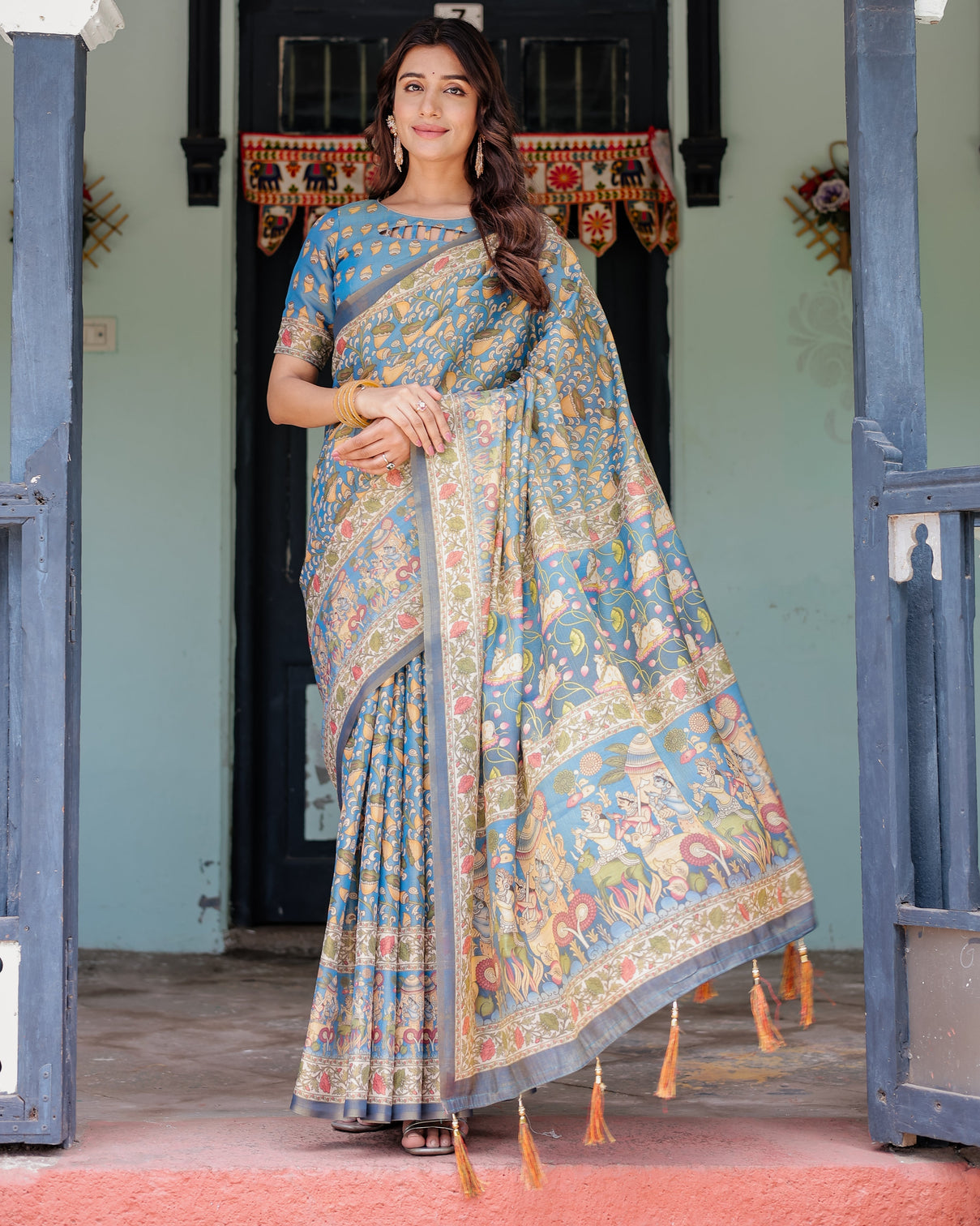 Divine blue handloom cotton saree with shankh krishna pallu motifs temple border tassels mameraa