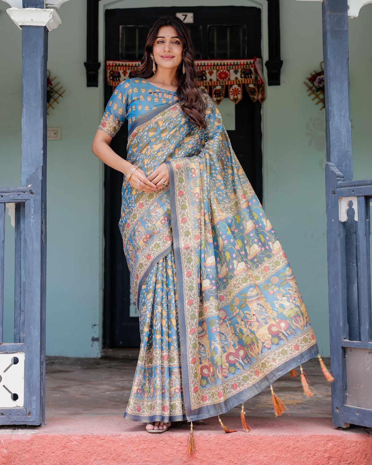 Divine blue handloom cotton saree with shankh krishna pallu motifs temple border tassels