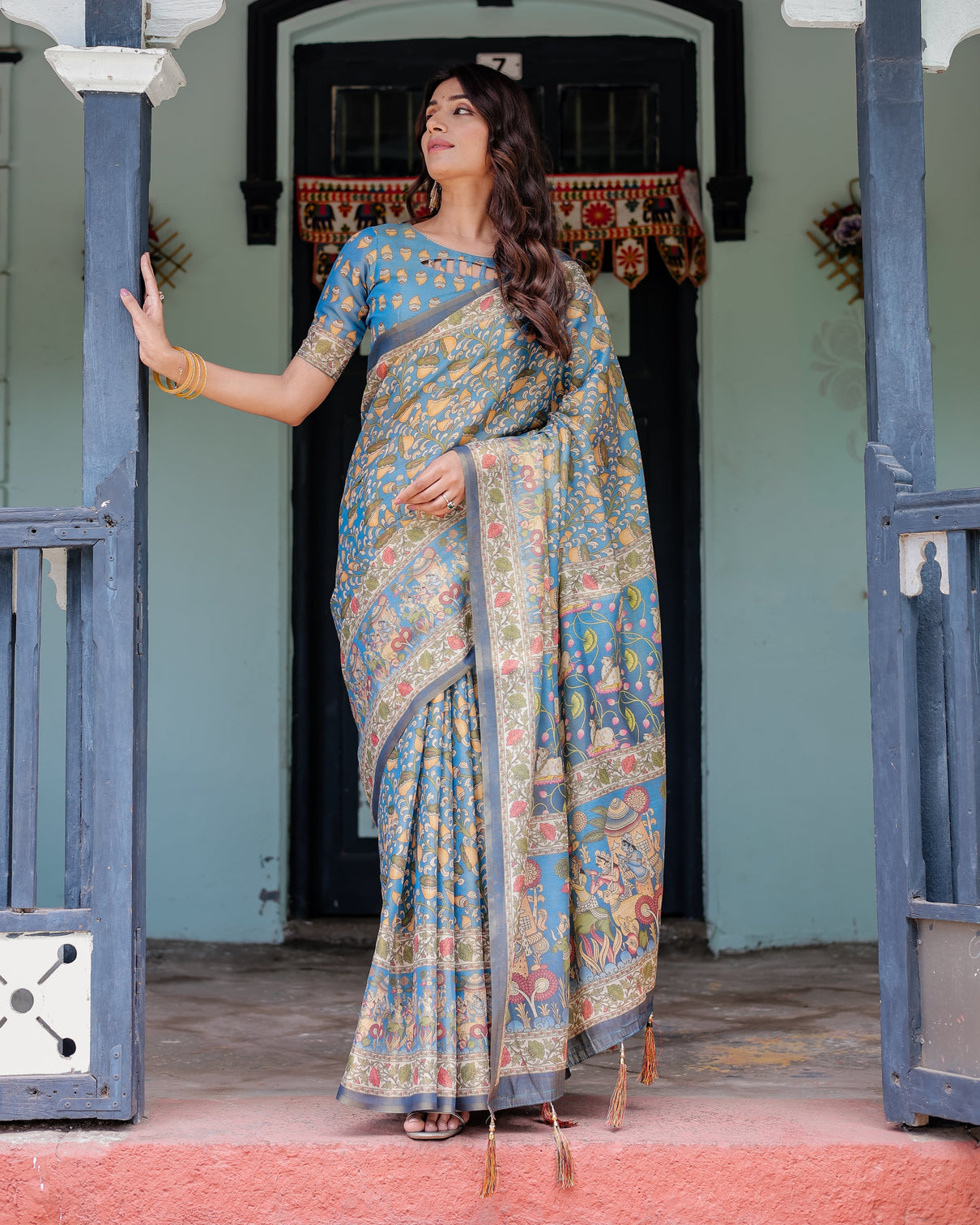 Divine blue handloom cotton saree with shankh krishna pallu motifs temple border tassels