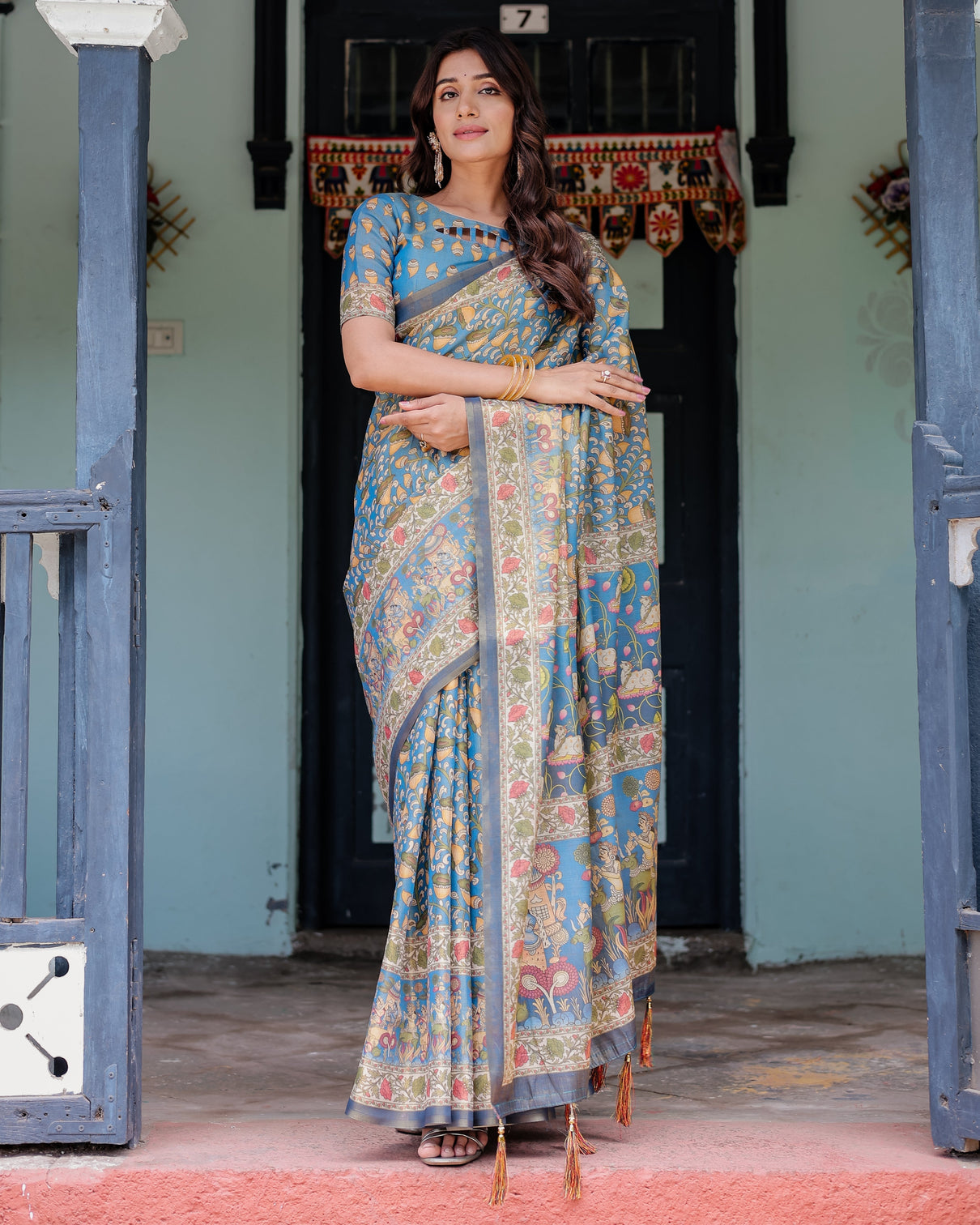 Divine blue handloom cotton saree with shankh krishna pallu motifs temple border tassels