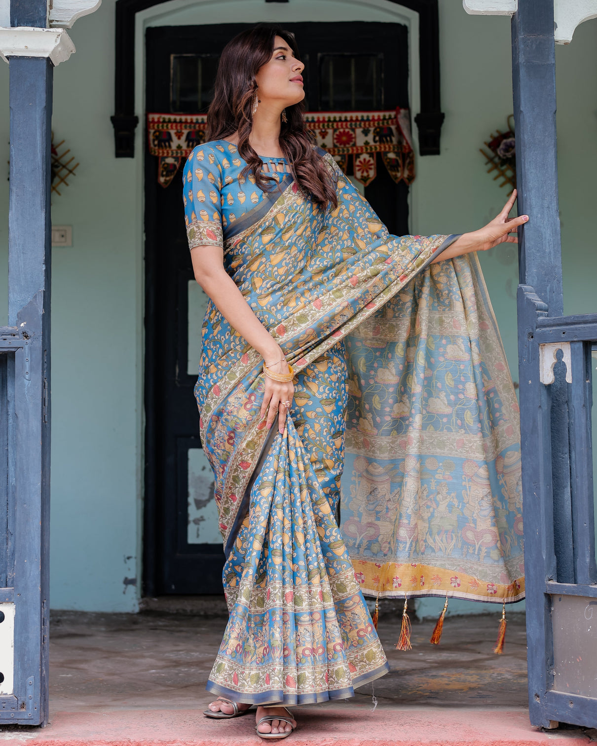 Divine blue handloom cotton saree with shankh krishna pallu motifs temple border tassels