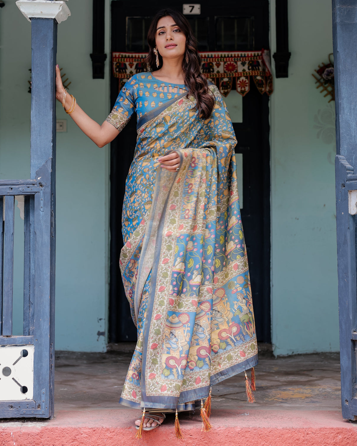 Divine blue handloom cotton saree with shankh krishna pallu motifs temple border tassels