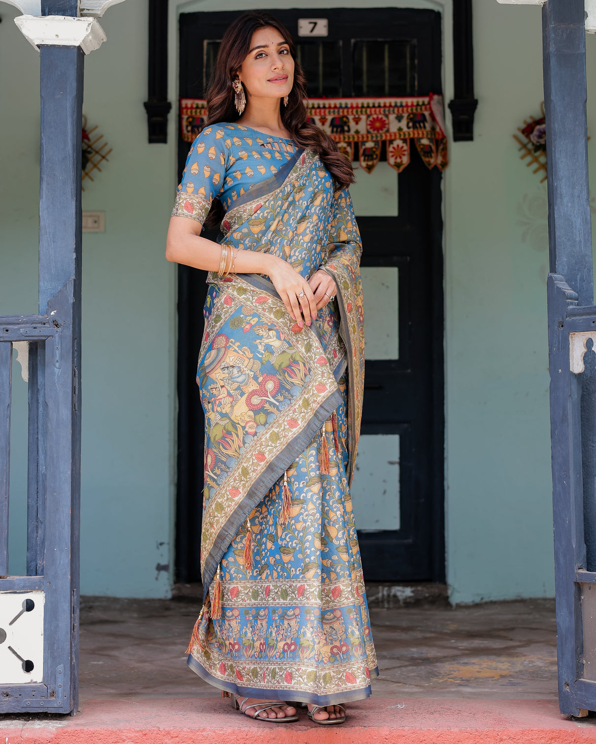 Divine blue handloom cotton saree with shankh krishna pallu motifs temple border tassels