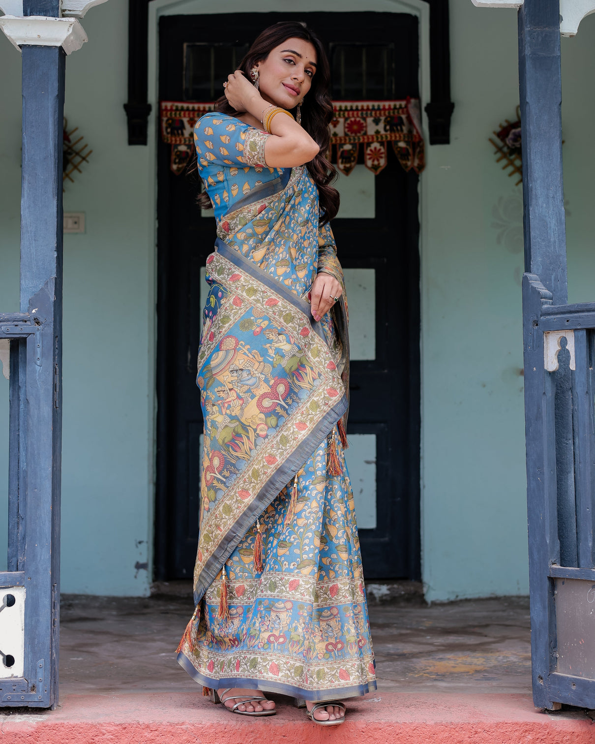 Divine blue handloom cotton saree with shankh krishna pallu motifs temple border tassels