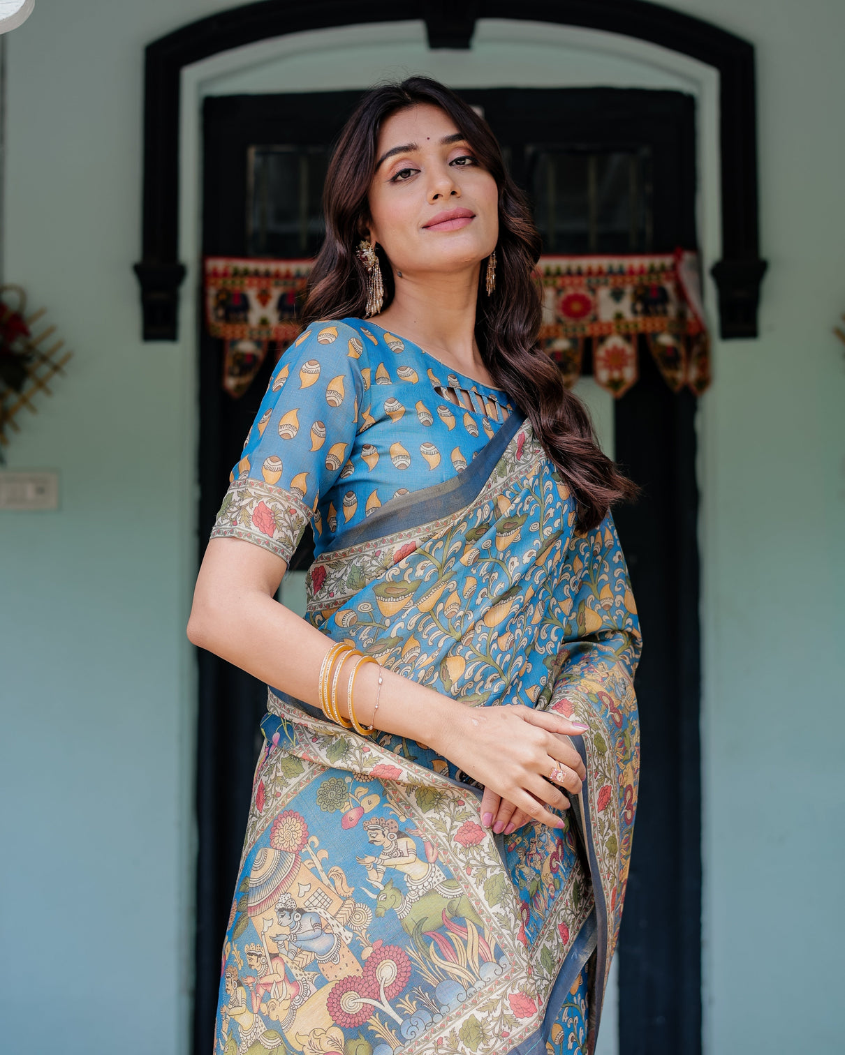 Divine blue handloom cotton saree with shankh krishna pallu motifs temple border tassels
