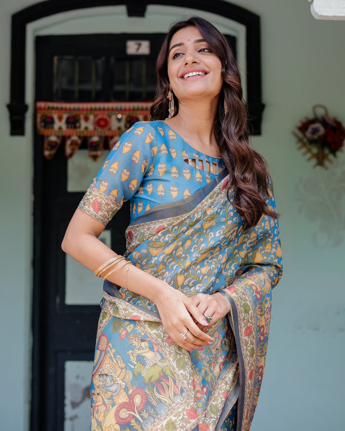 Divine blue handloom cotton saree with shankh krishna pallu motifs temple border tassels