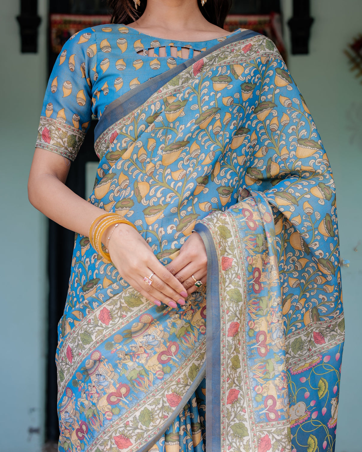 Divine blue handloom cotton saree with shankh krishna pallu motifs temple border tassels