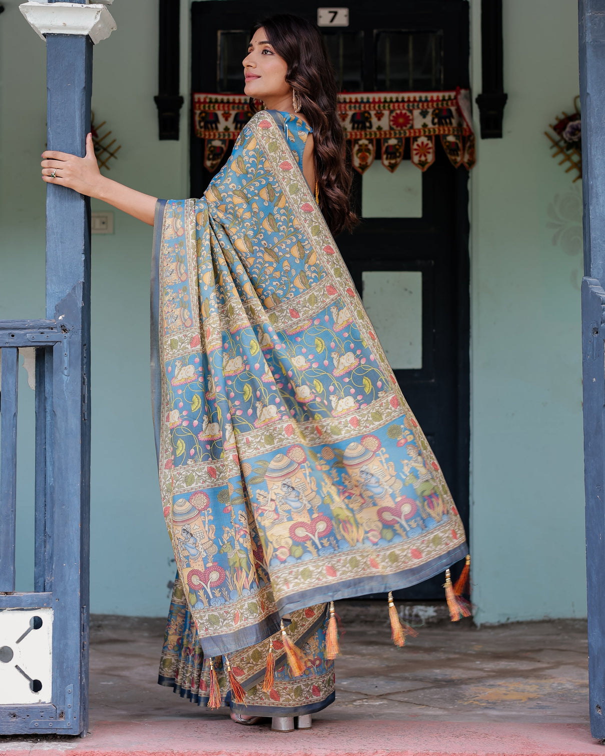 Divine blue handloom cotton saree with shankh krishna pallu motifs temple border tassels