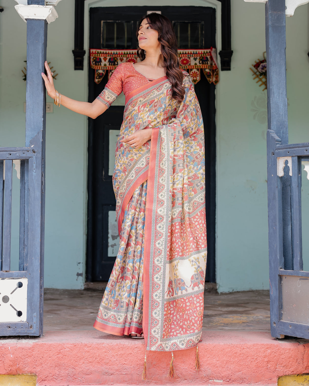 Rust beige handloom cotton saree with vibrant elephant parade print red floral pallu