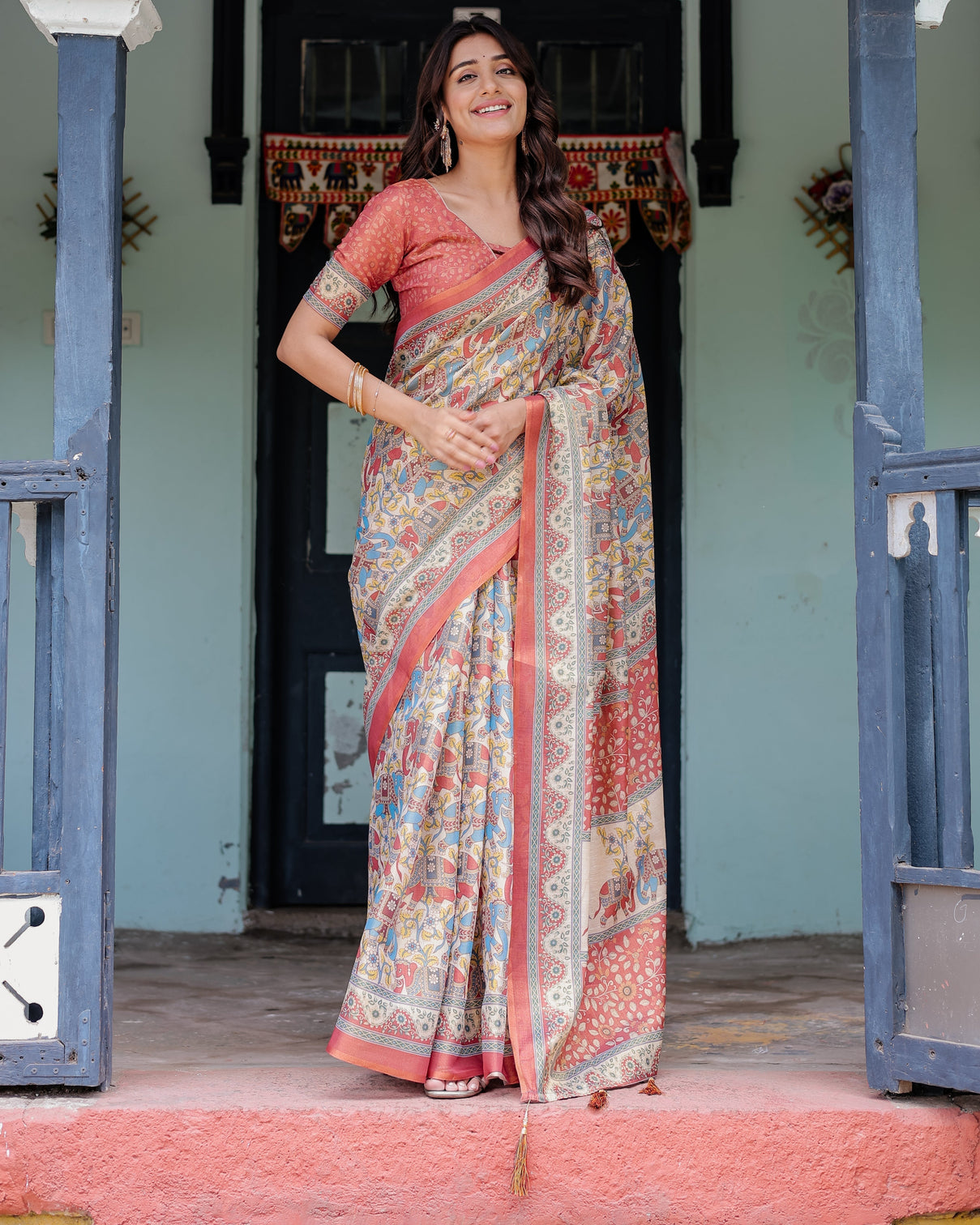 Rust beige handloom cotton saree with vibrant elephant parade print red floral pallu