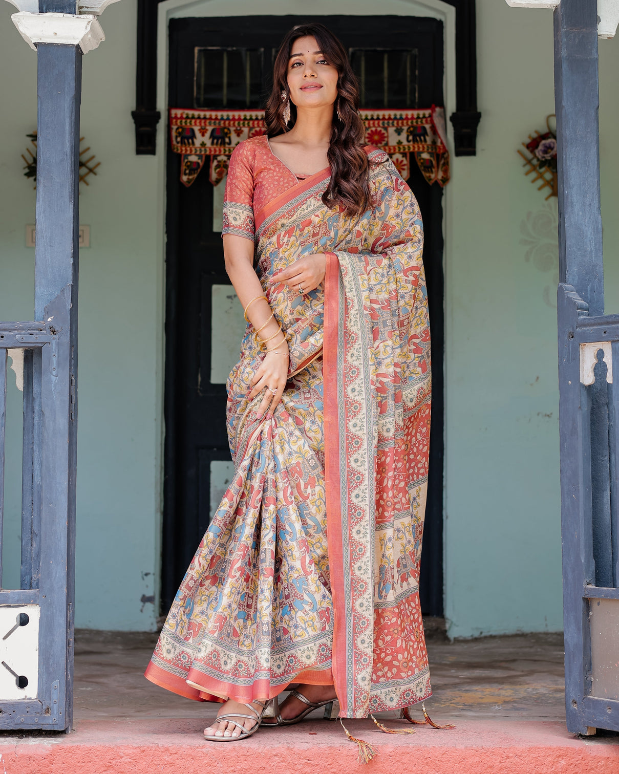 Rust beige handloom cotton saree with vibrant elephant parade print red floral pallu mameraa