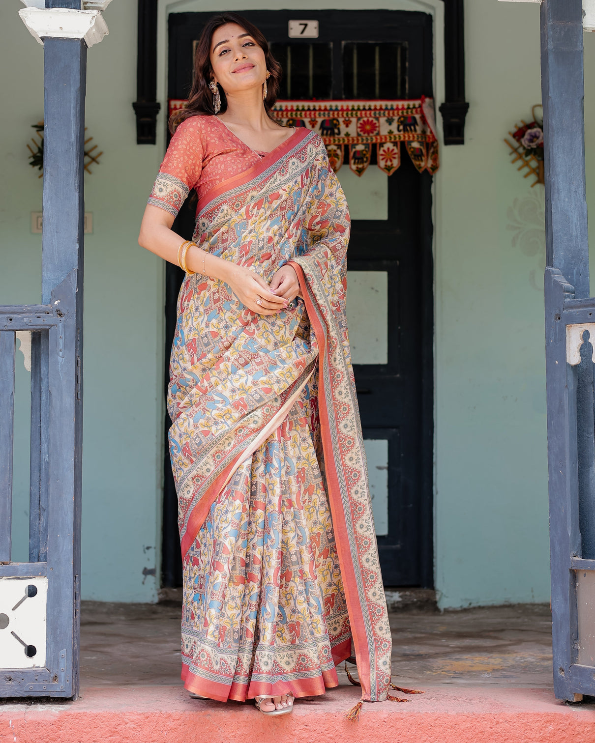 Rust beige handloom cotton saree with vibrant elephant parade print red floral pallu