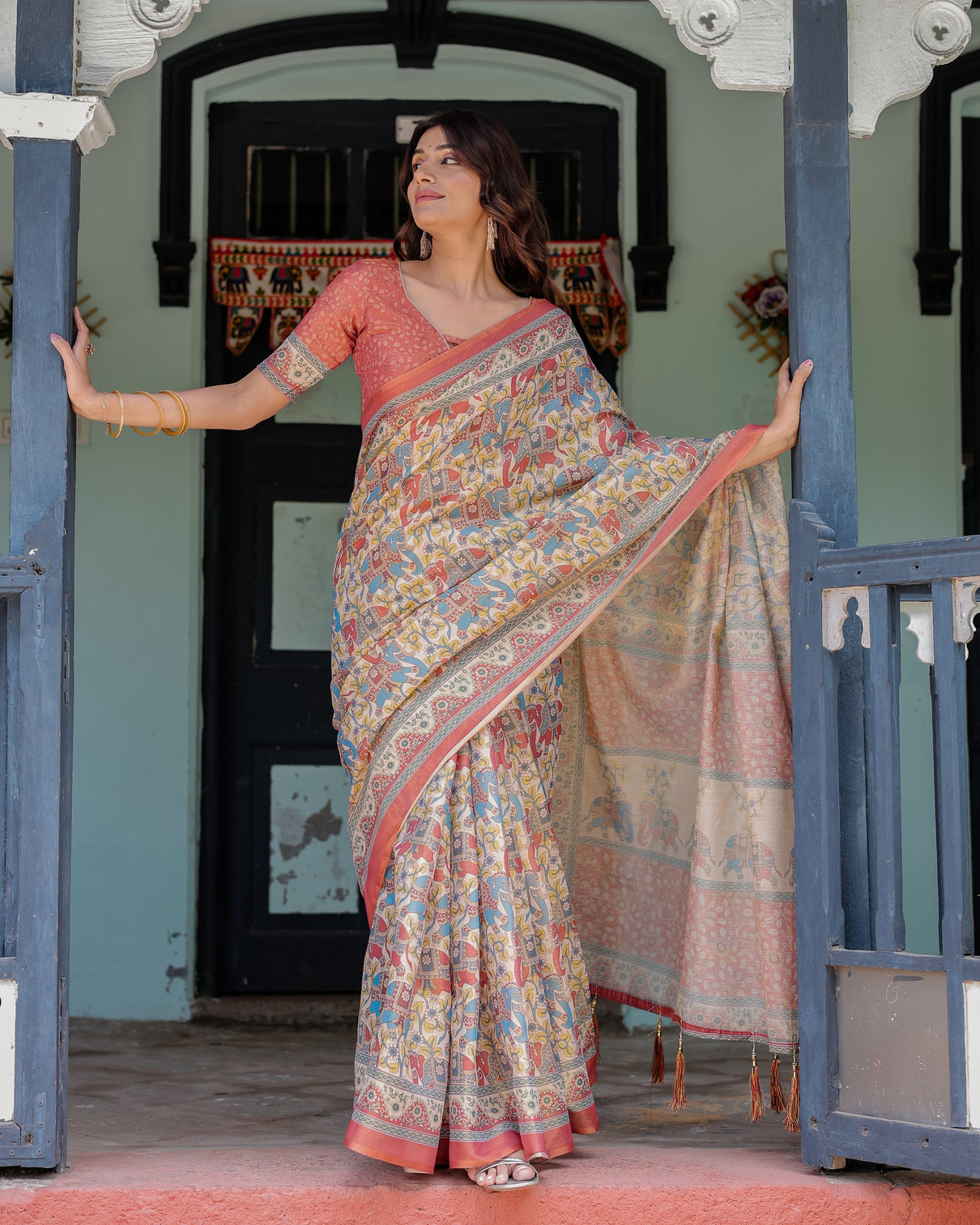 Rust beige handloom cotton saree with vibrant elephant parade print red floral pallu