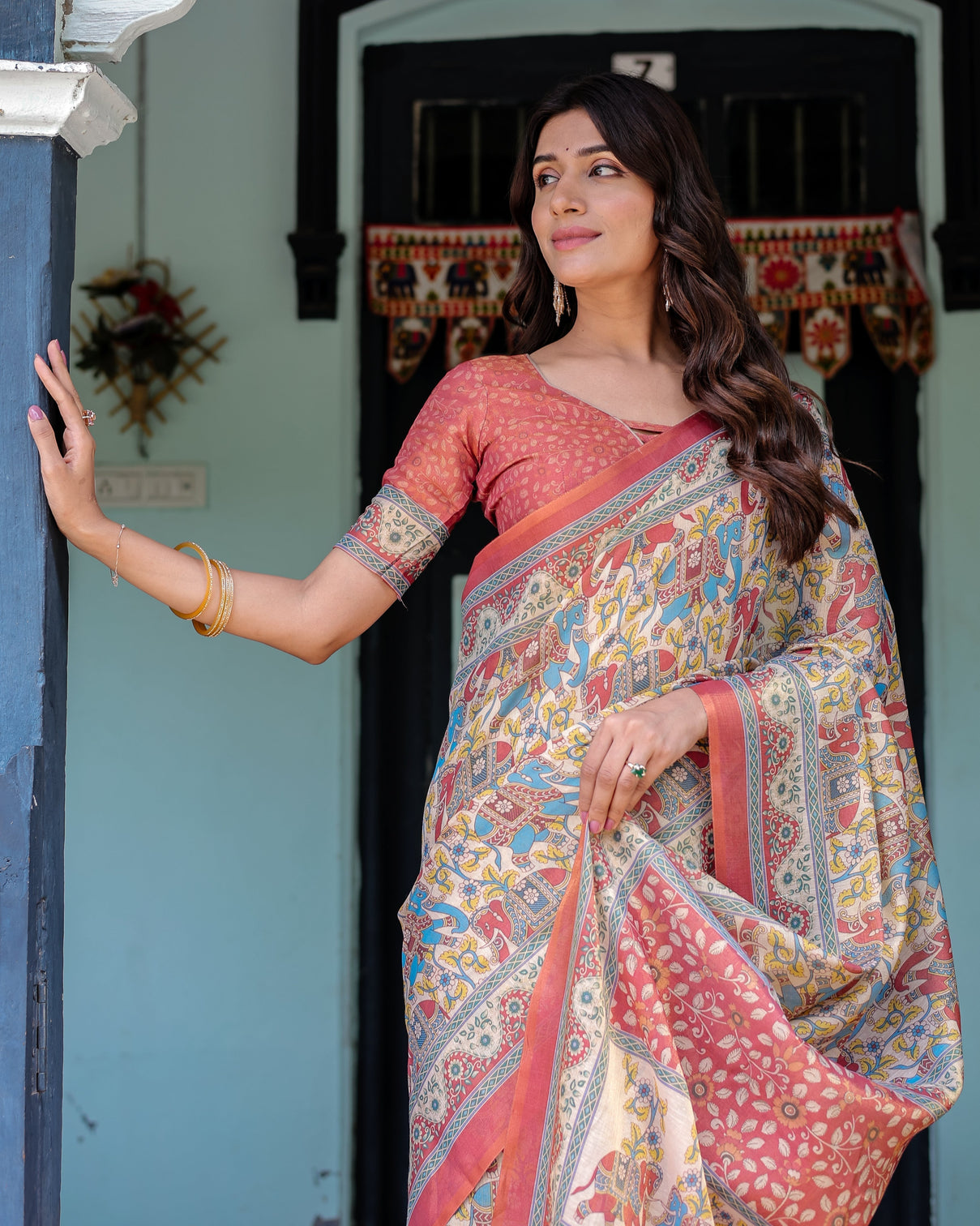 Rust beige handloom cotton saree with vibrant elephant parade print red floral pallu