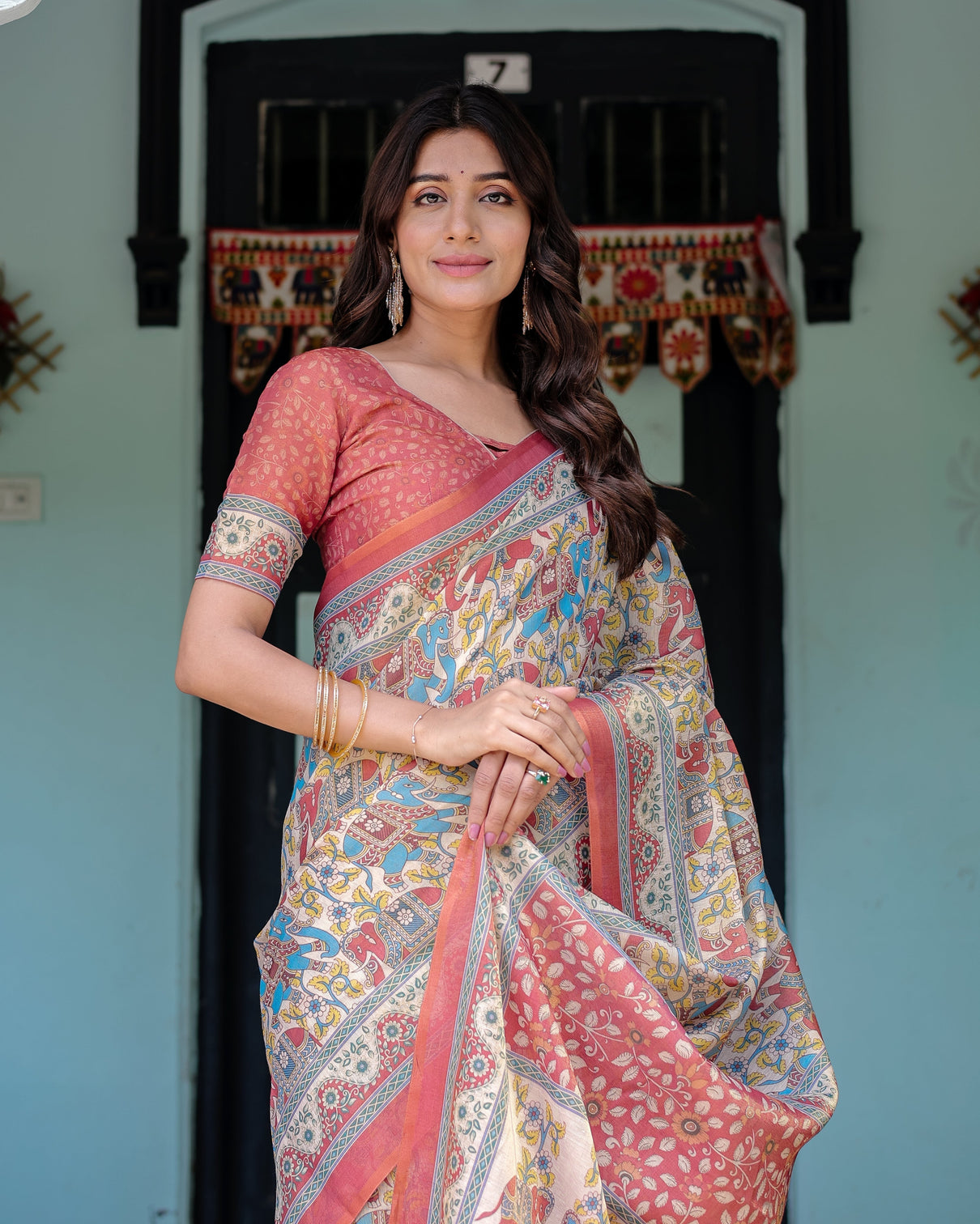 Rust beige handloom cotton saree with vibrant elephant parade print red floral pallu