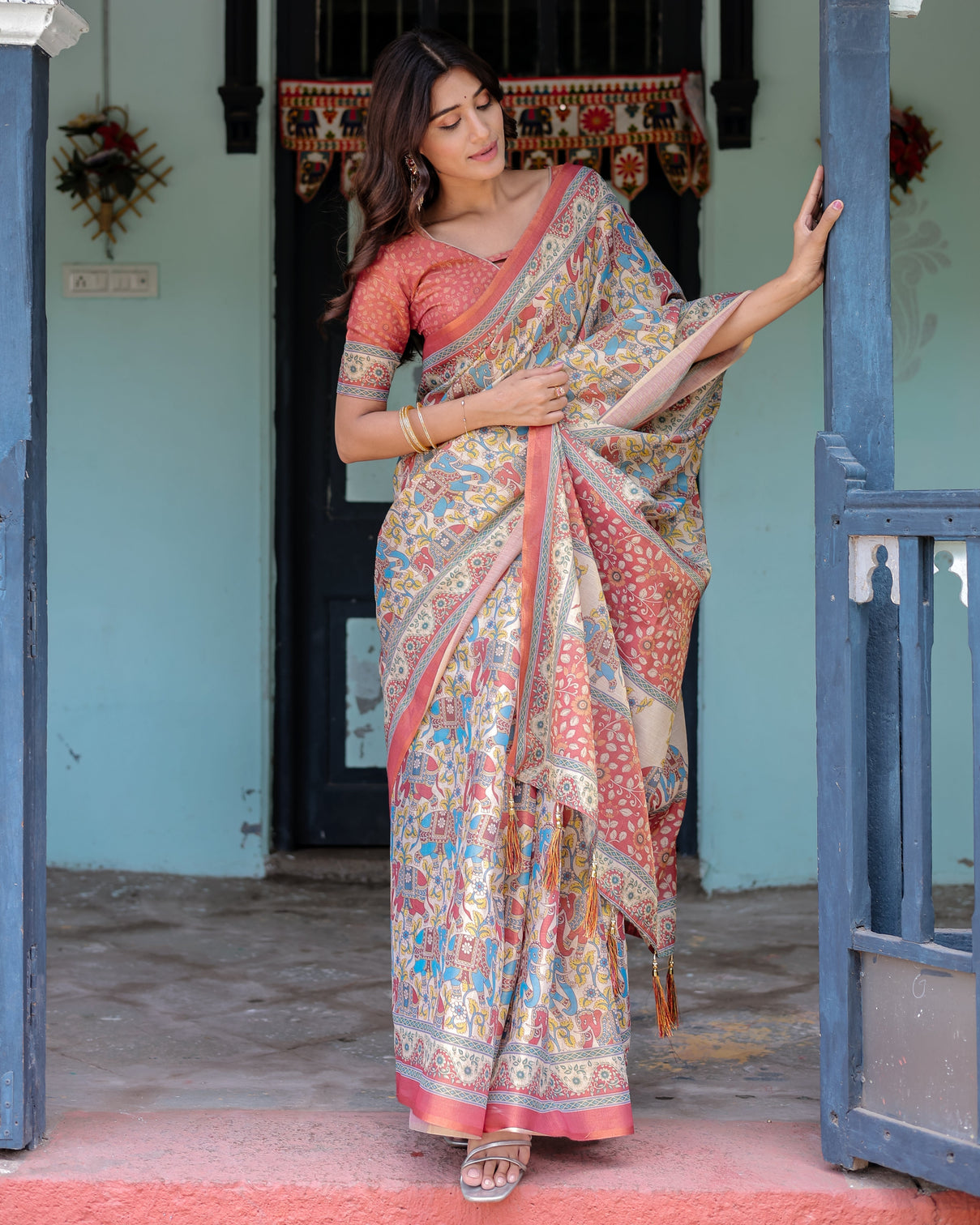 Rust beige handloom cotton saree with vibrant elephant parade print red floral pallu