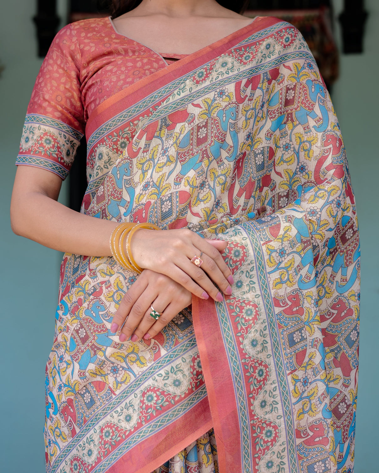 Rust beige handloom cotton saree with vibrant elephant parade print red floral pallu