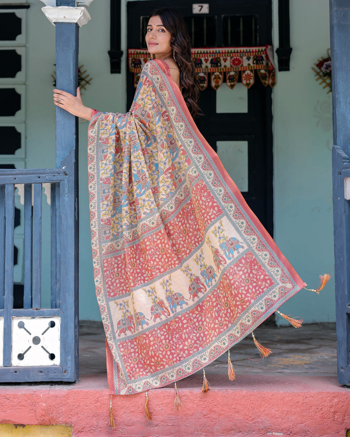 Rust beige handloom cotton saree with vibrant elephant parade print red floral pallu