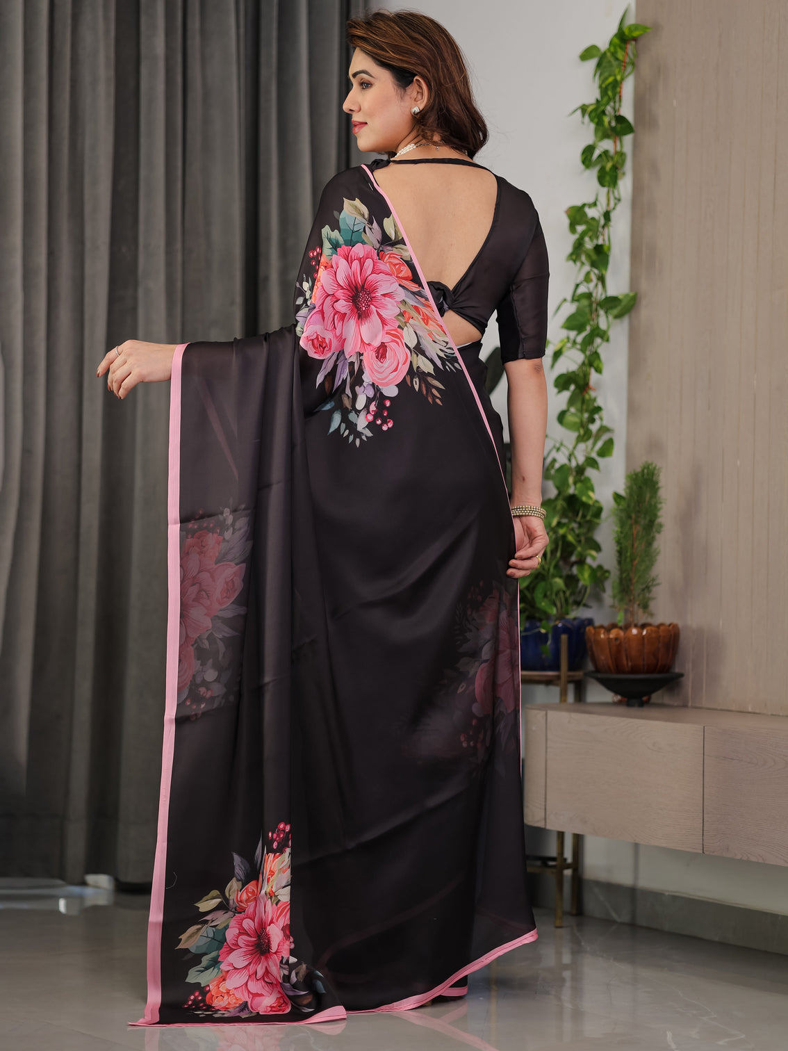 Black satin georgette floral printed saree with soft pink border attached blouse elegant designer partywear drape