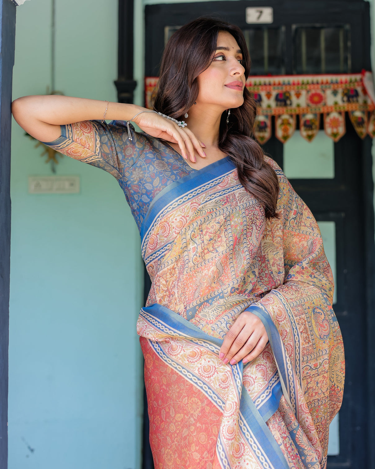 Rust blue handloom cotton saree with classical dancer motif and patchwork digital print