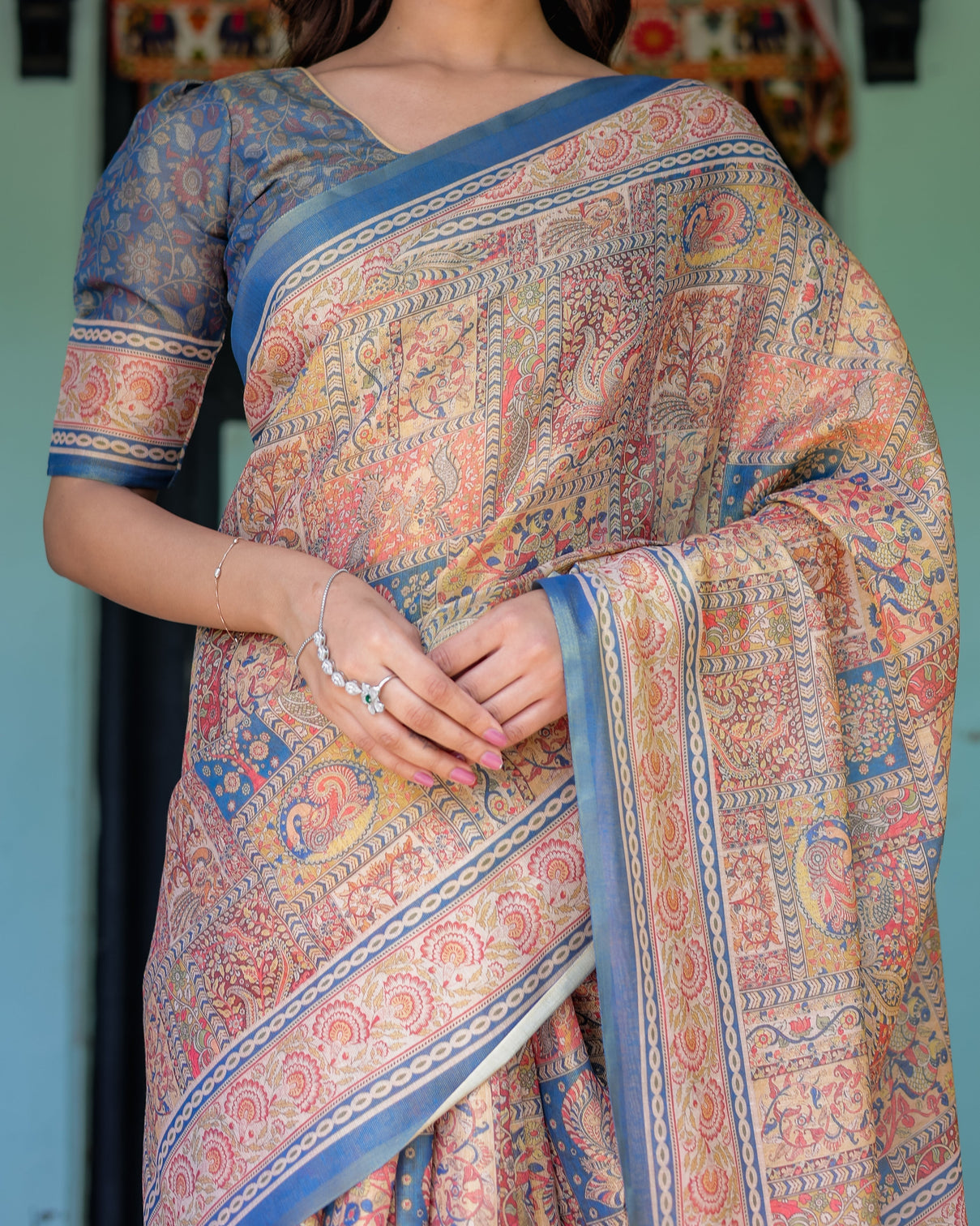 Rust blue handloom cotton saree with classical dancer motif and patchwork digital print