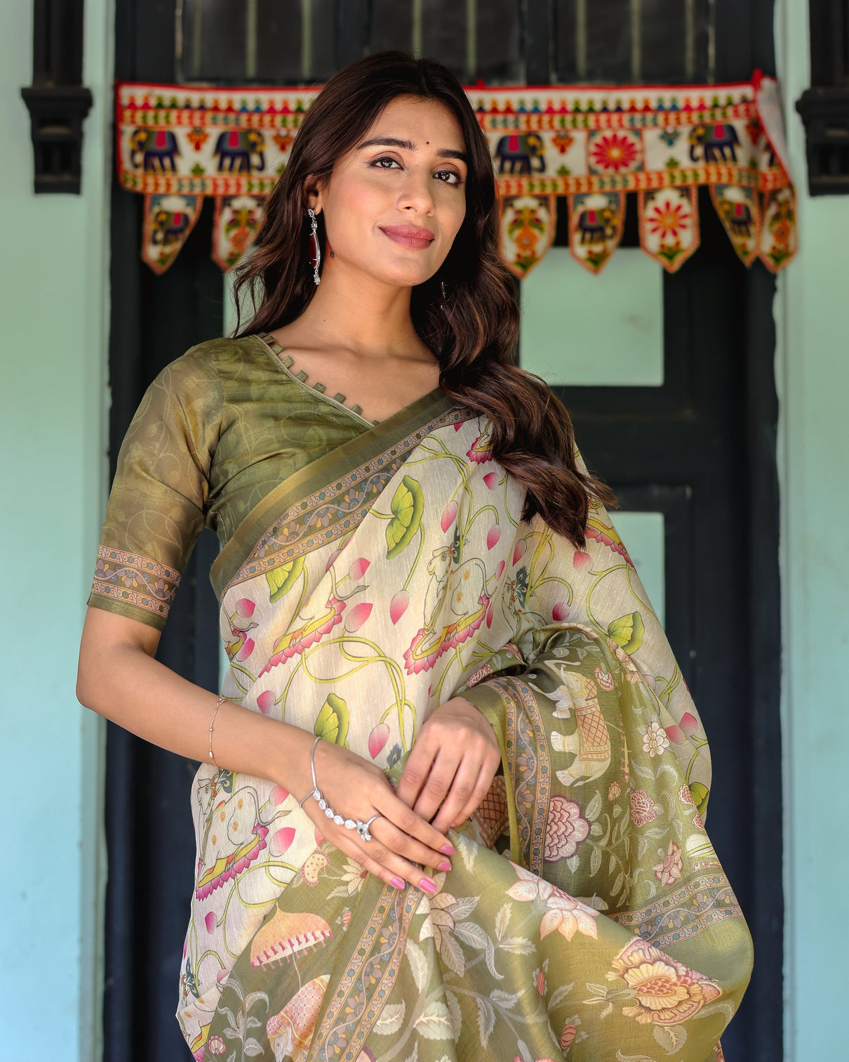 Olive green ivory handloom cotton saree with lotus blooms and royal elephant motifs