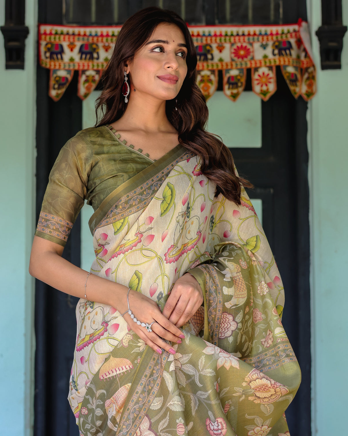 Olive green ivory handloom cotton saree with lotus blooms and royal elephant motifs