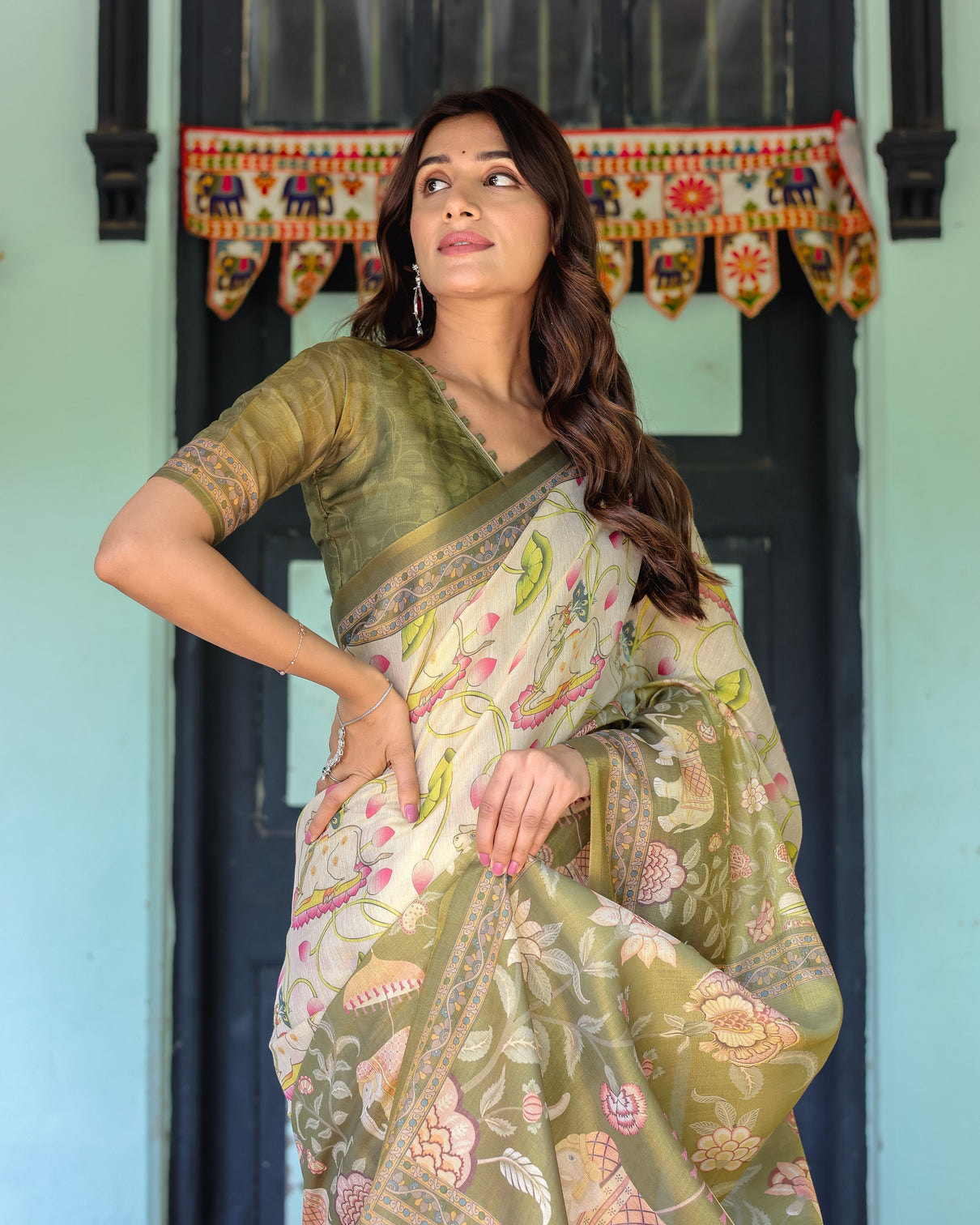 Olive green ivory handloom cotton saree with lotus blooms and royal elephant motifs