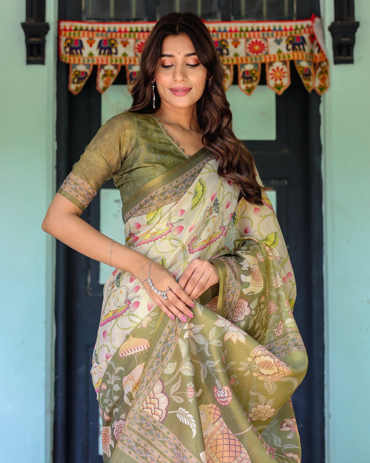 Olive green ivory handloom cotton saree with lotus blooms and royal elephant motifs