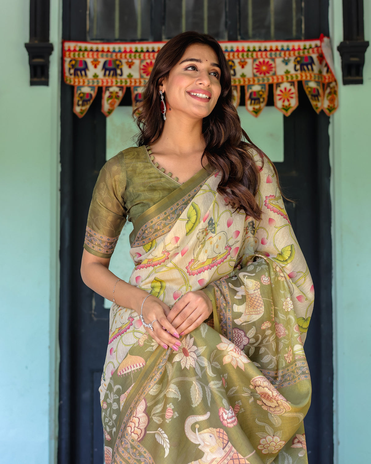 Olive green ivory handloom cotton saree with lotus blooms and royal elephant motifs