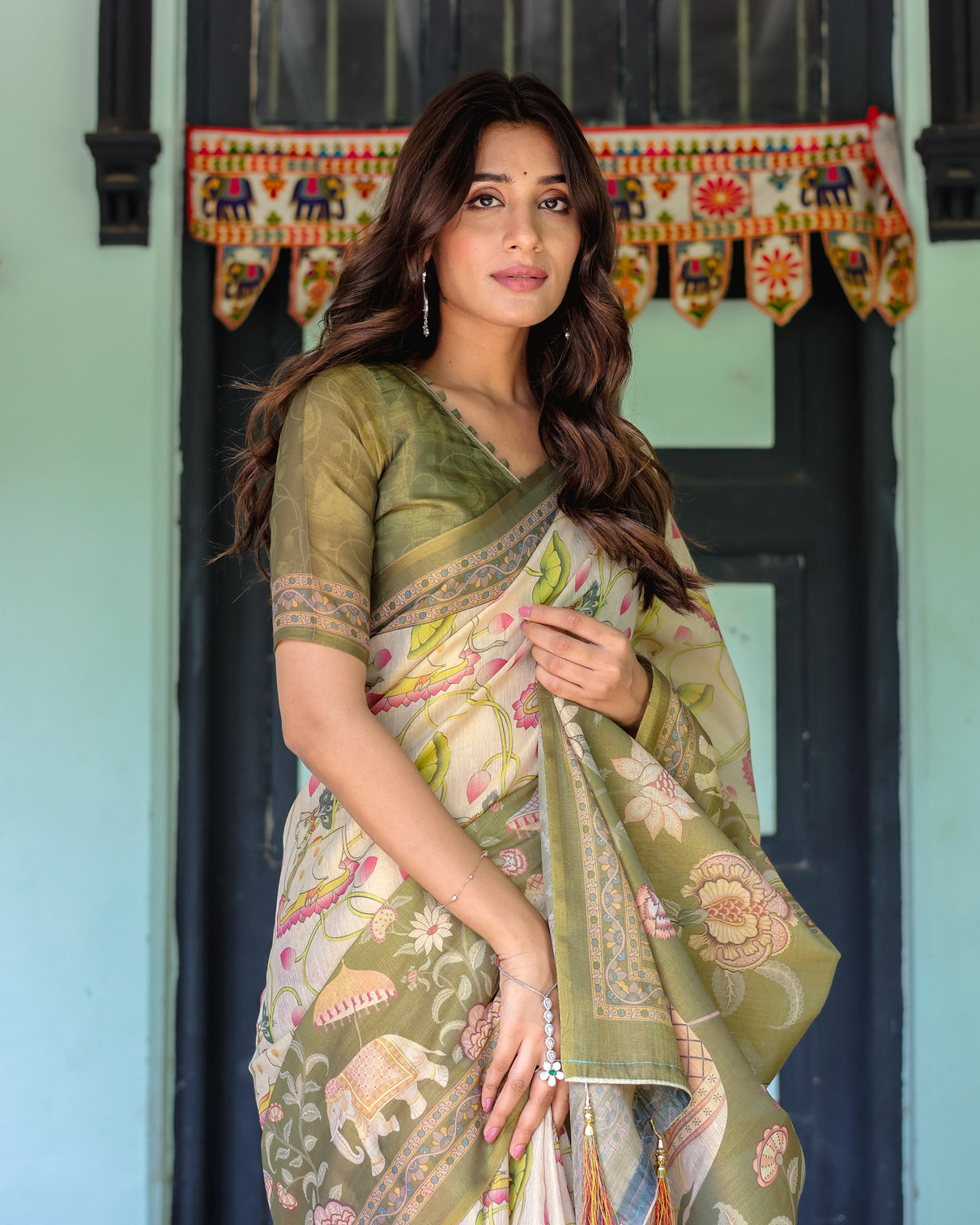 Olive green ivory handloom cotton saree with lotus blooms and royal elephant motifs