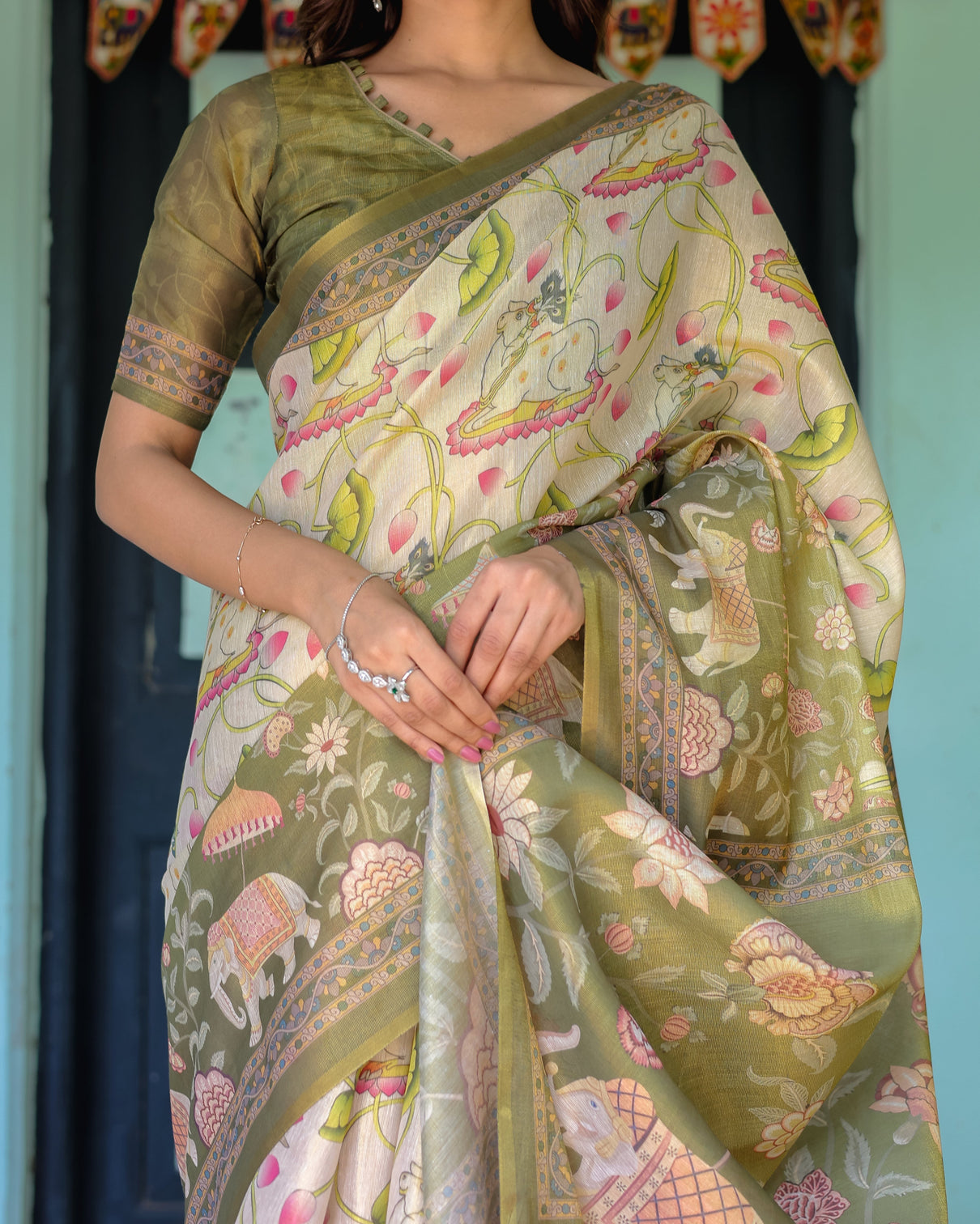 Olive green ivory handloom cotton saree with lotus blooms and royal elephant motifs