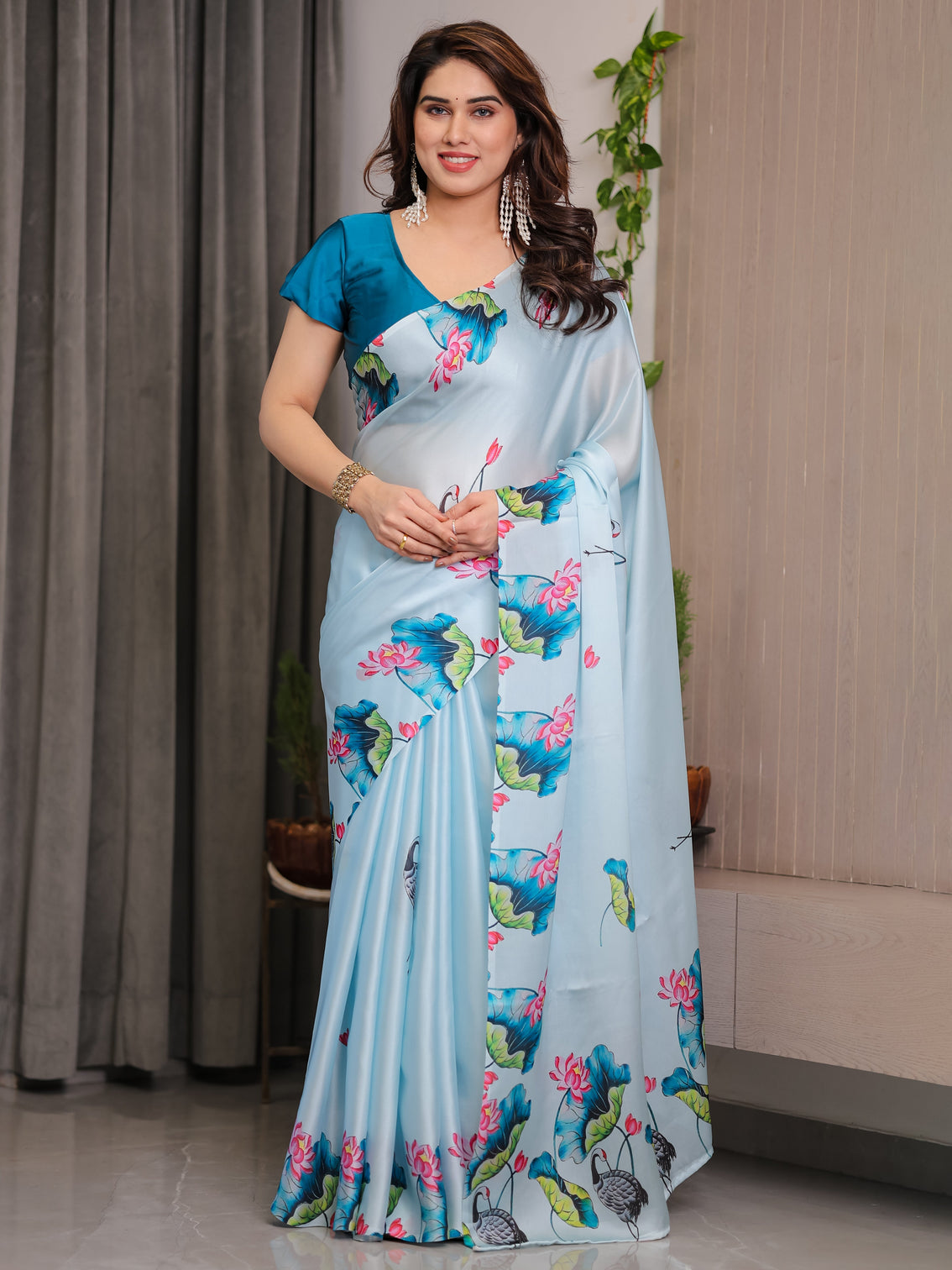 Sky blue satin georgette lotus crane printed saree with attached blouse serene nature inspired designer drape