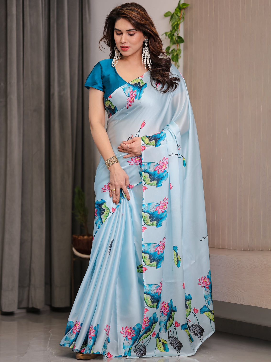 Sky blue satin georgette lotus crane printed saree with attached blouse serene nature inspired designer drape