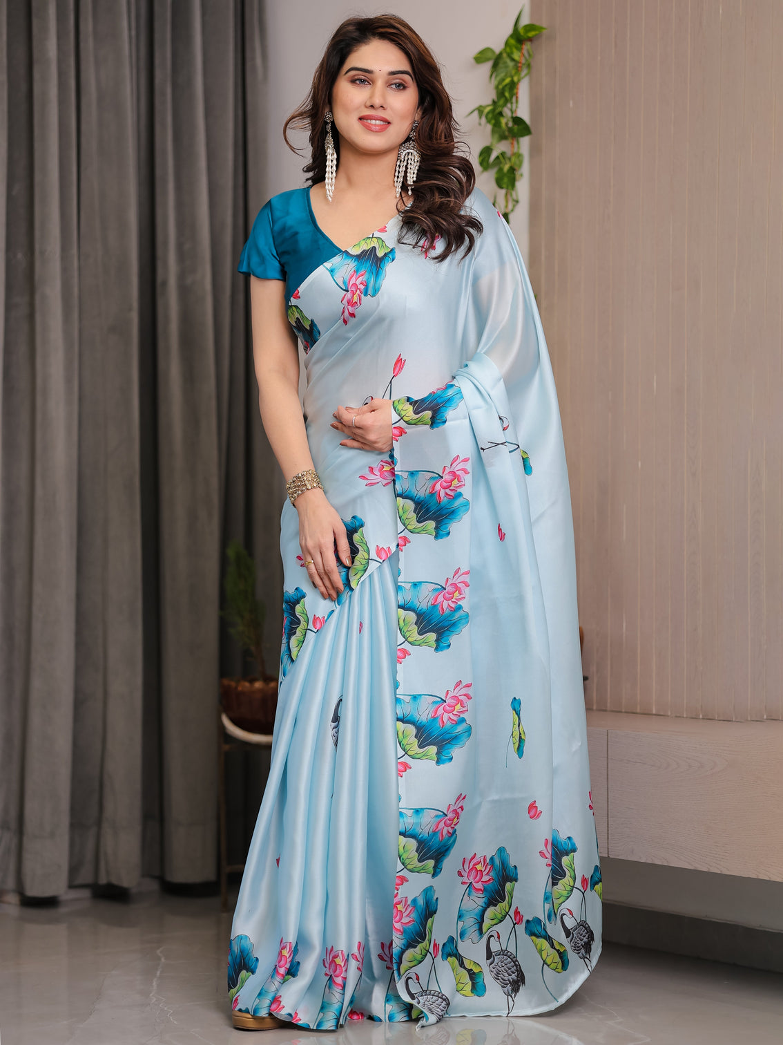 Sky blue satin georgette lotus crane printed saree with attached blouse serene nature inspired designer drape mameraa